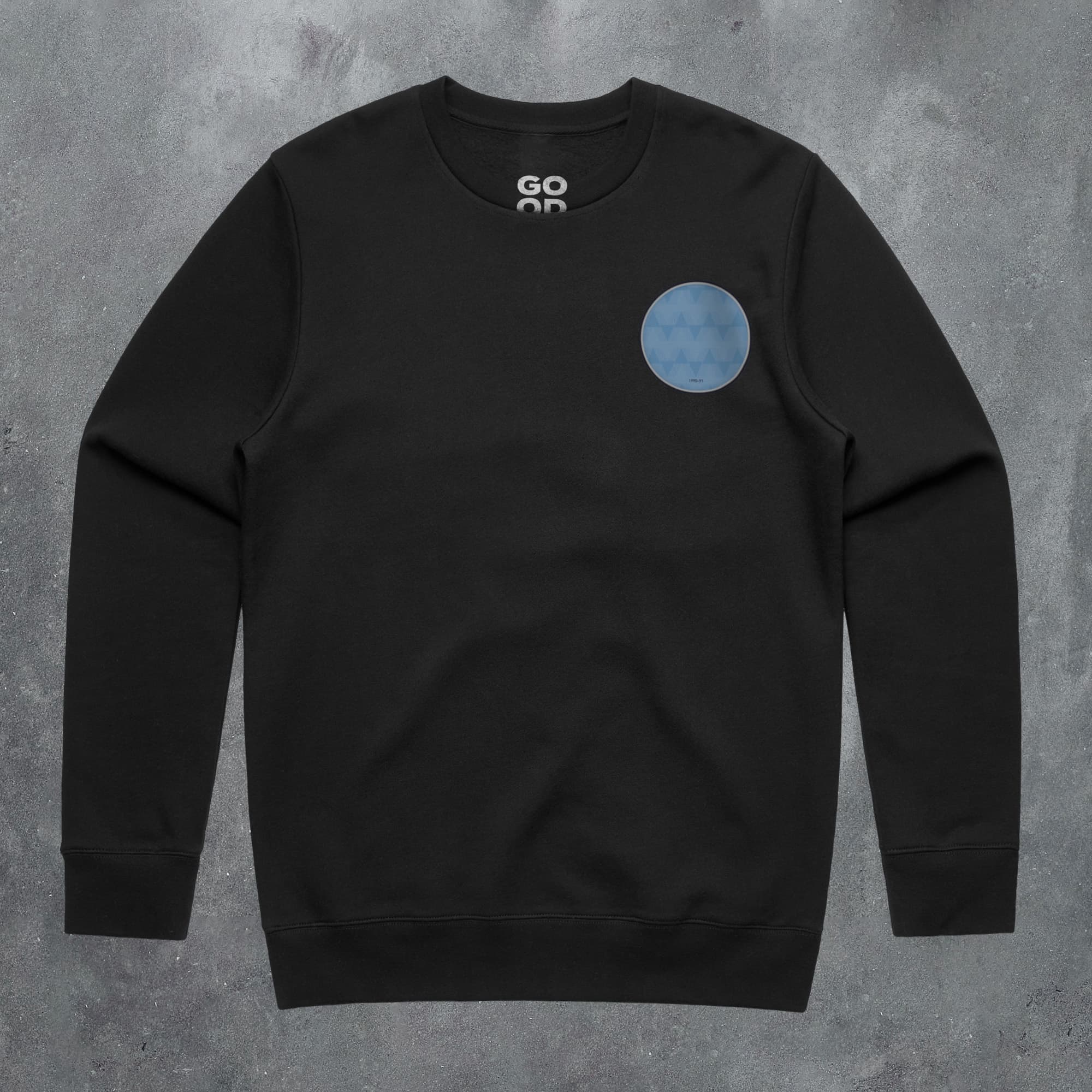 a black sweatshirt with a blue circle on it