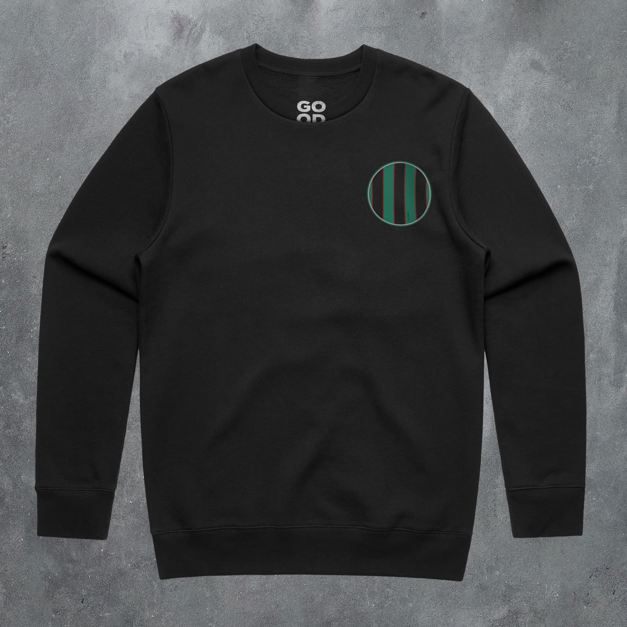 a black sweatshirt with a green circle on it