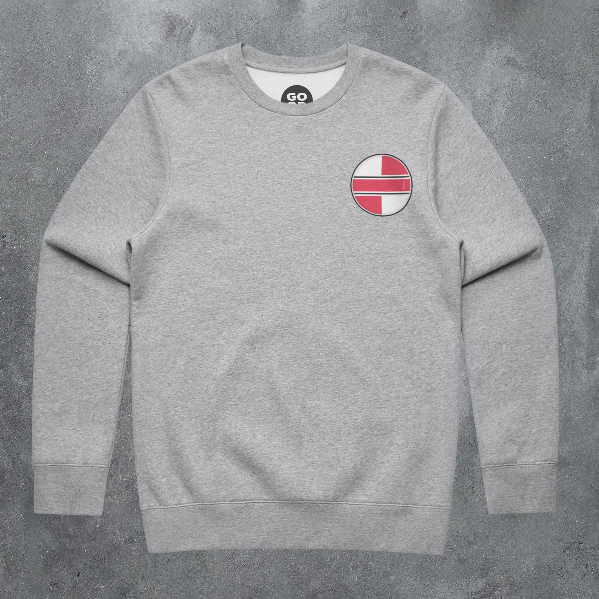 a grey sweatshirt with a red and white stripe on the chest