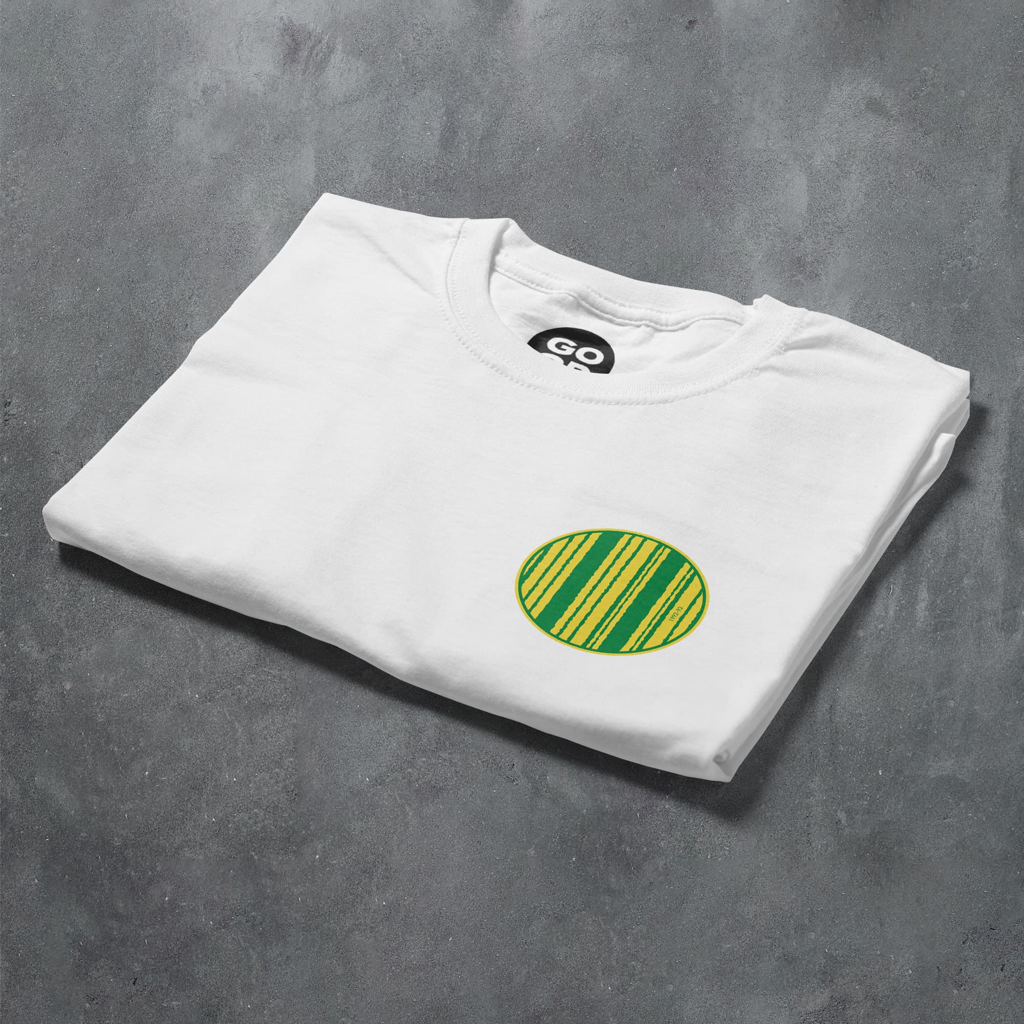 a white t - shirt with a green circle on it