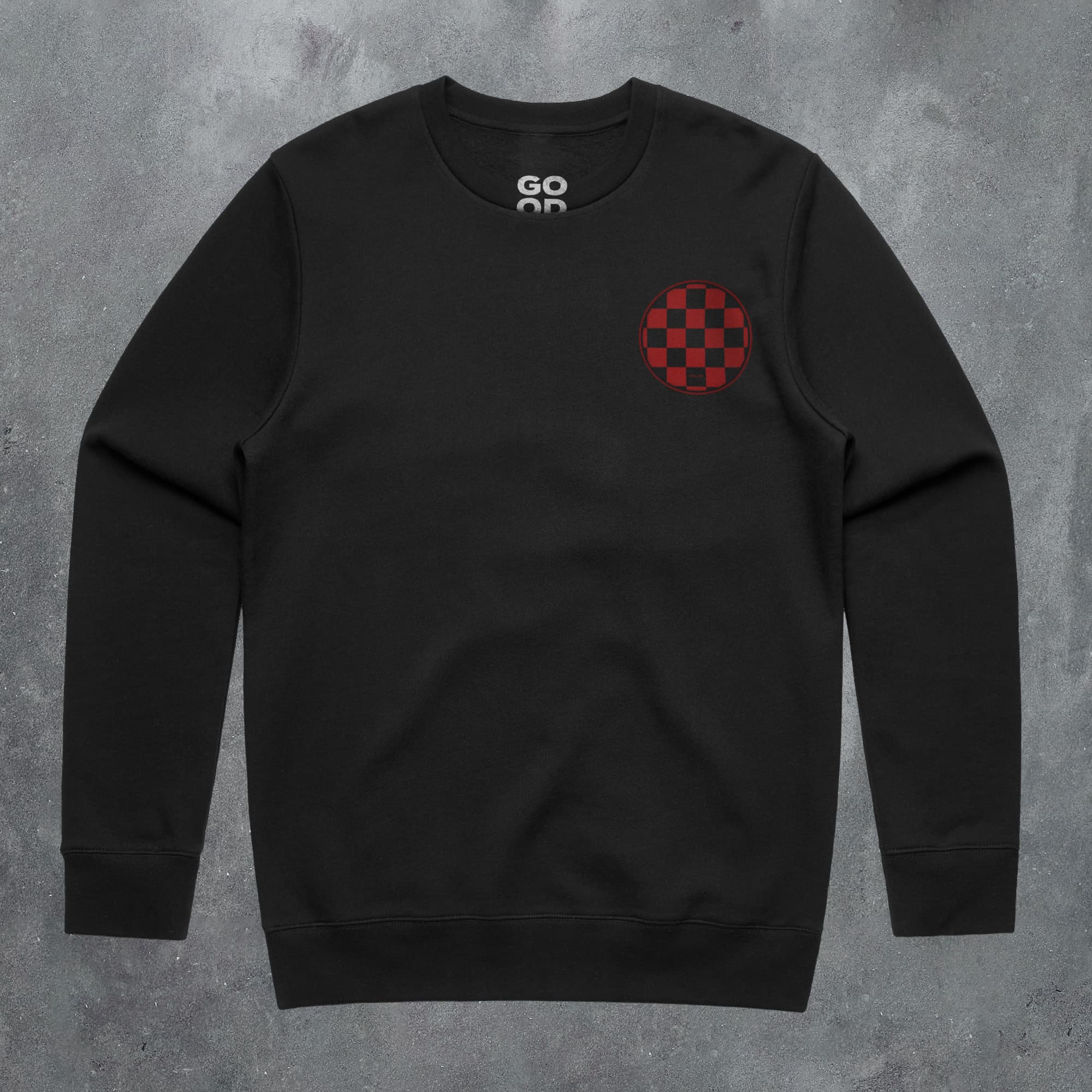 a black sweatshirt with a red checkered design on it