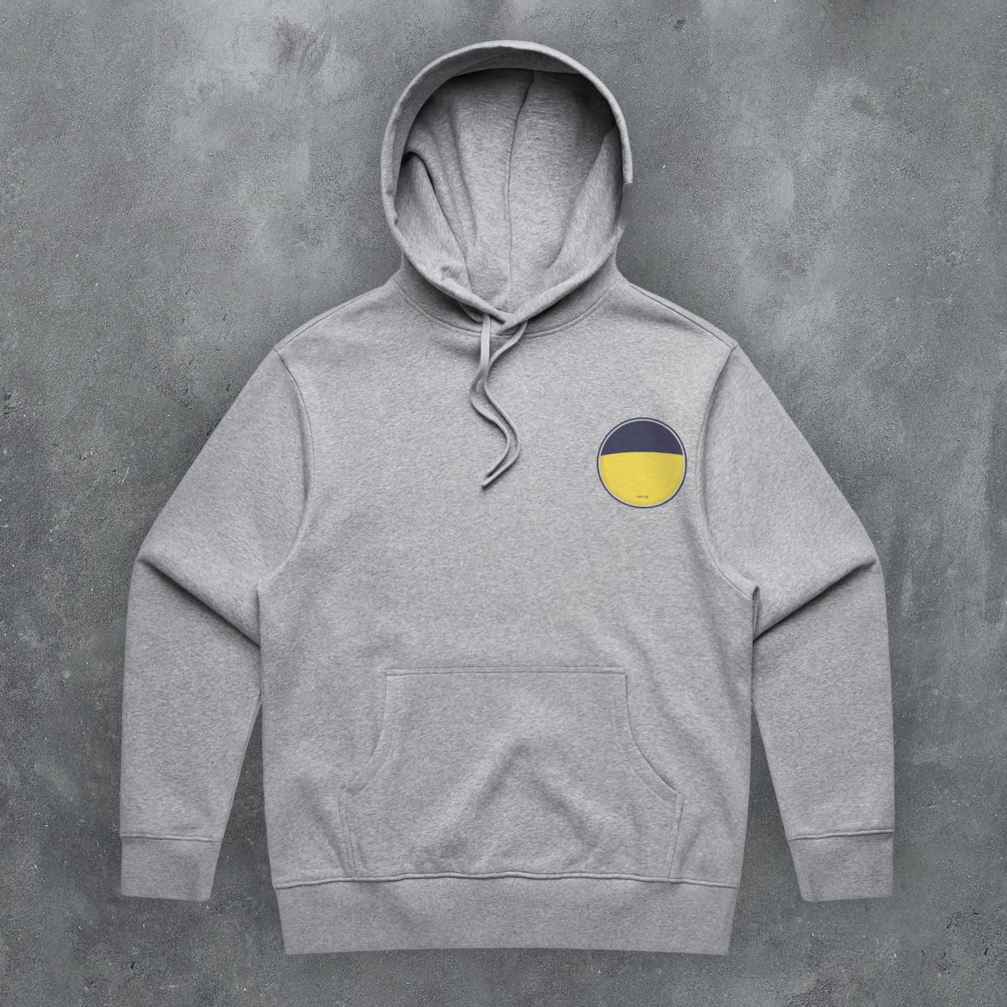 a grey hoodie with a yellow circle on it