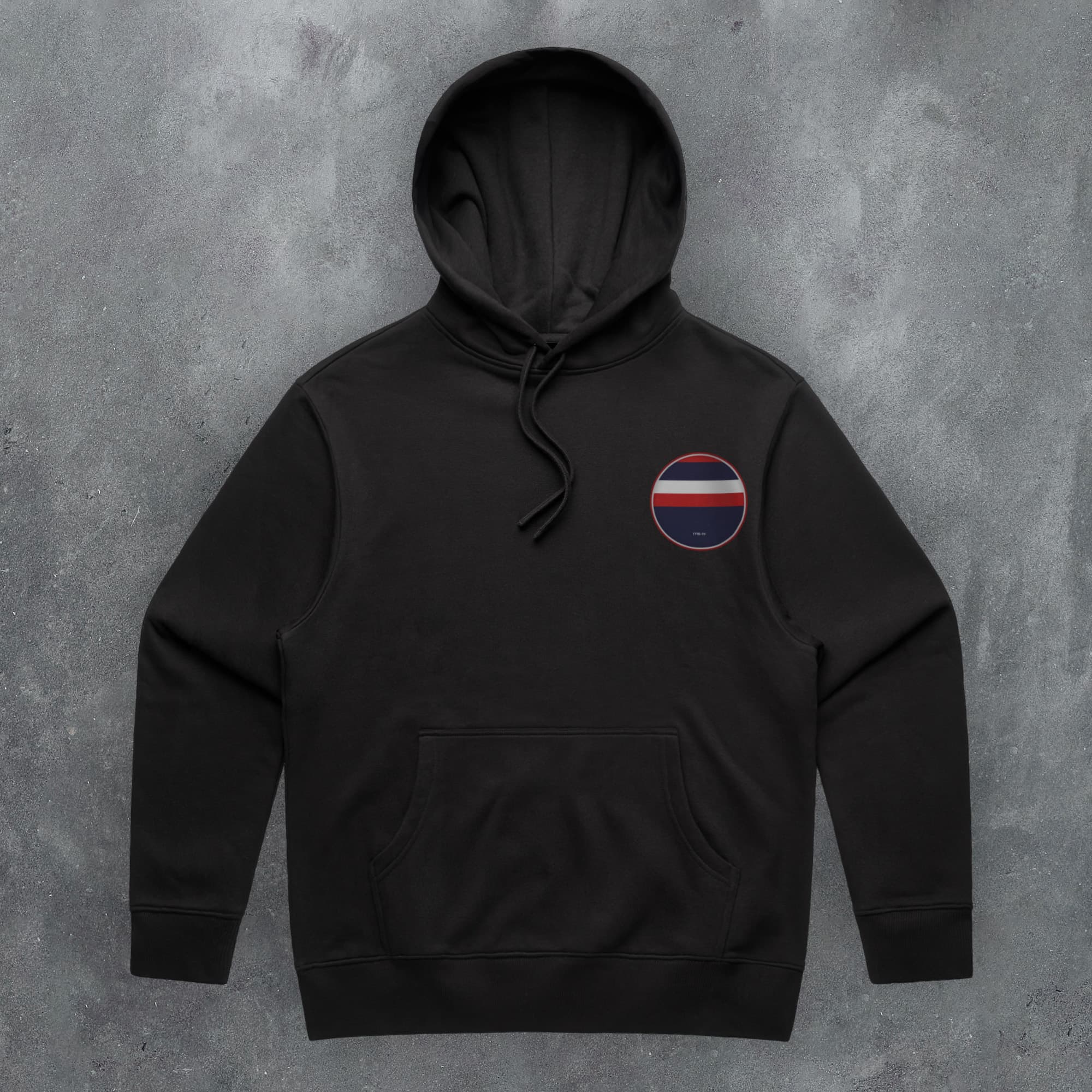 a black hoodie with a red, white, and blue stripe on the chest