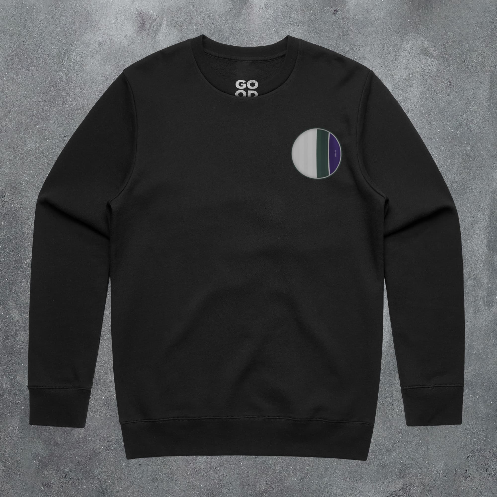 a black sweatshirt with a green, white and blue circle on it