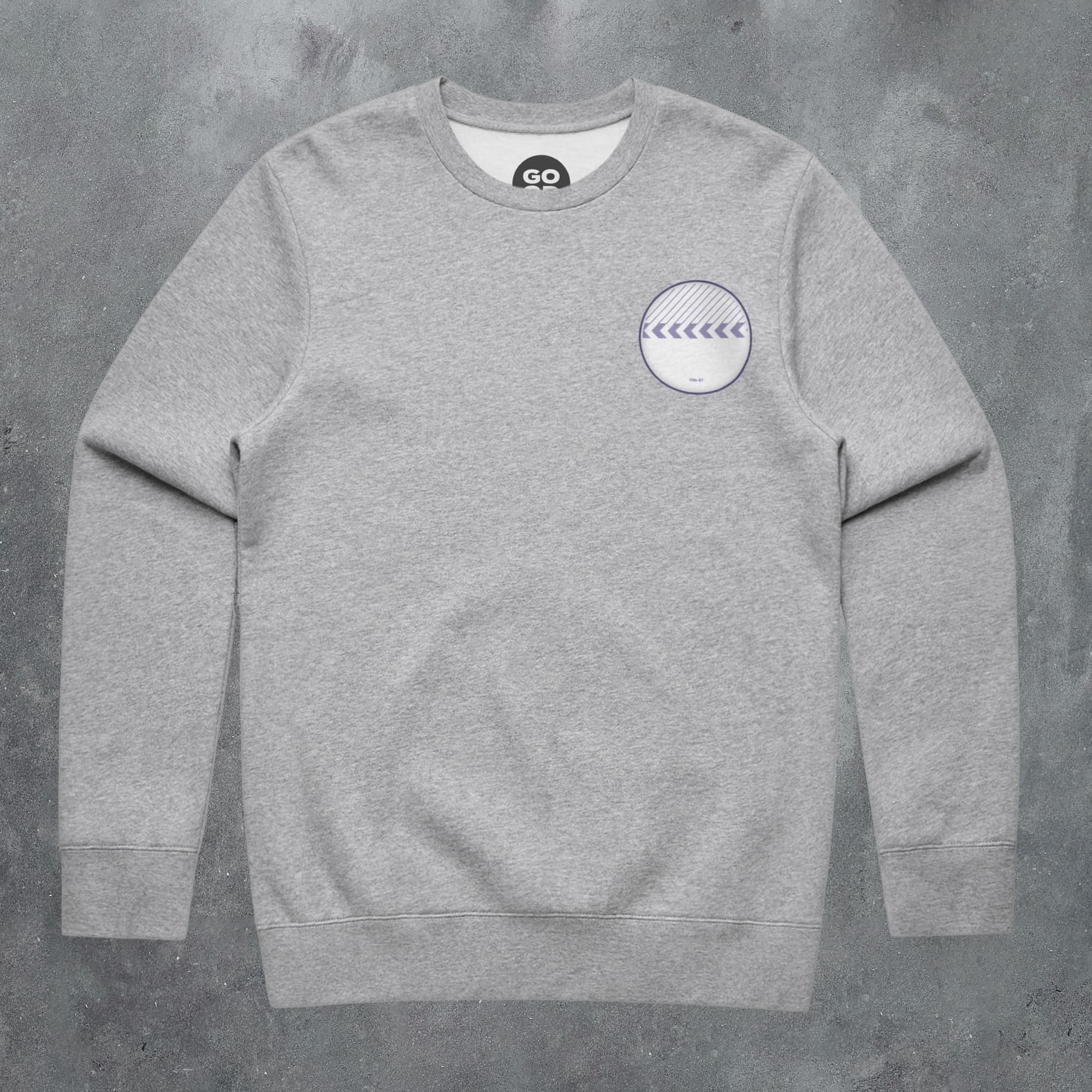 a grey sweatshirt with a white circle on it
