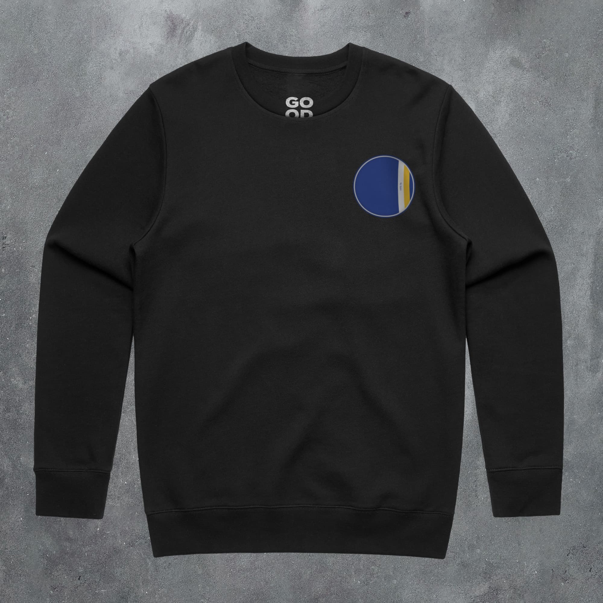 a black sweatshirt with a blue and yellow circle on it