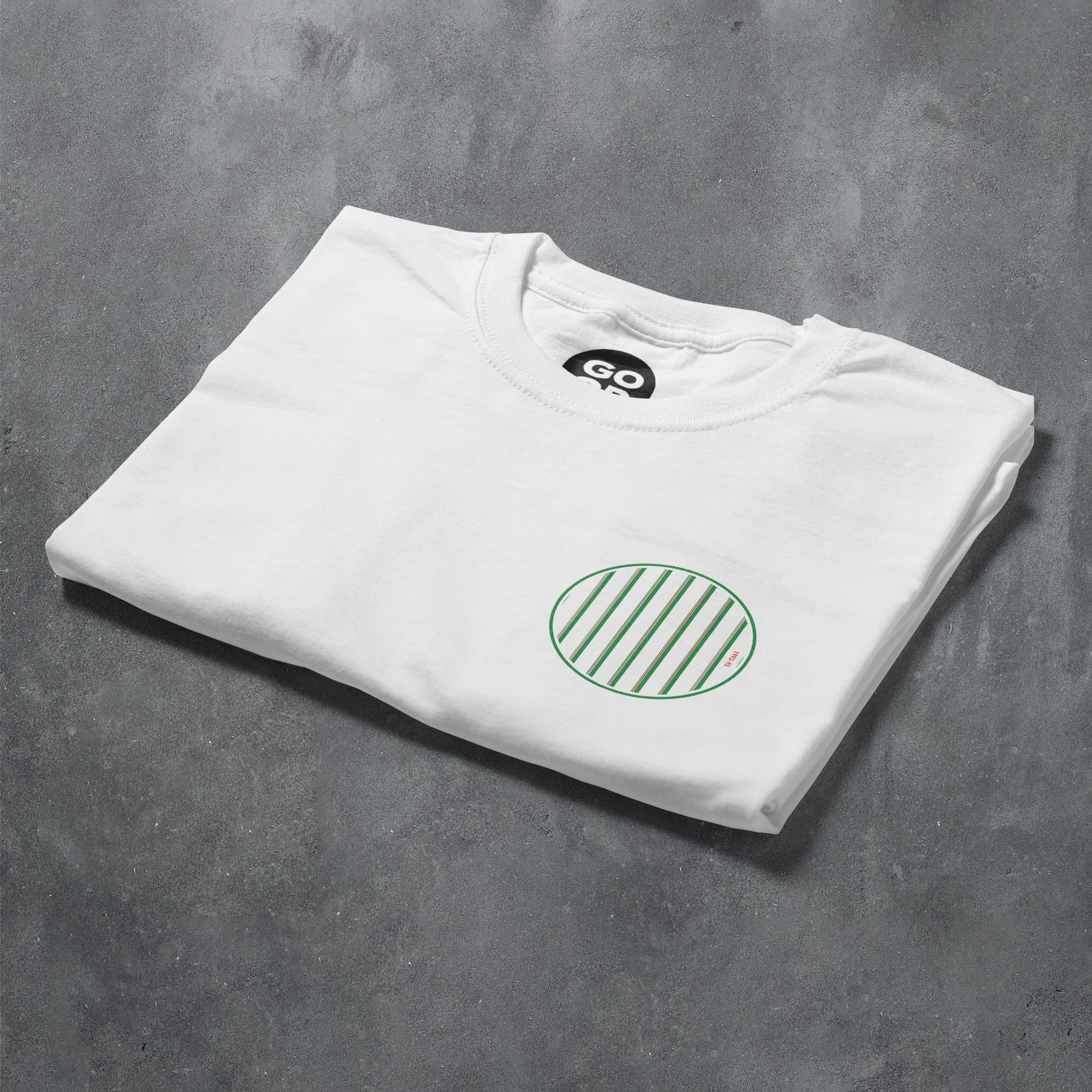 a white t - shirt with a green circle on it