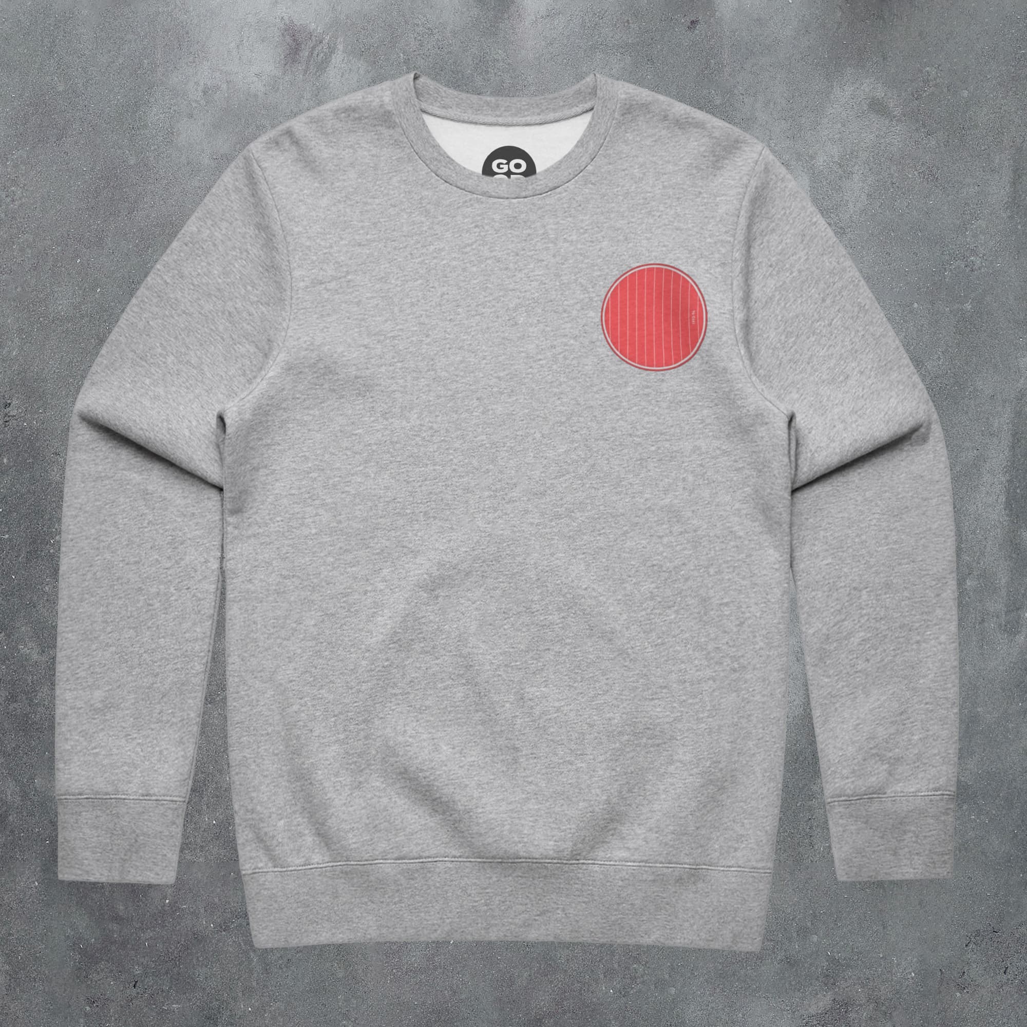 a grey sweatshirt with a red circle on it