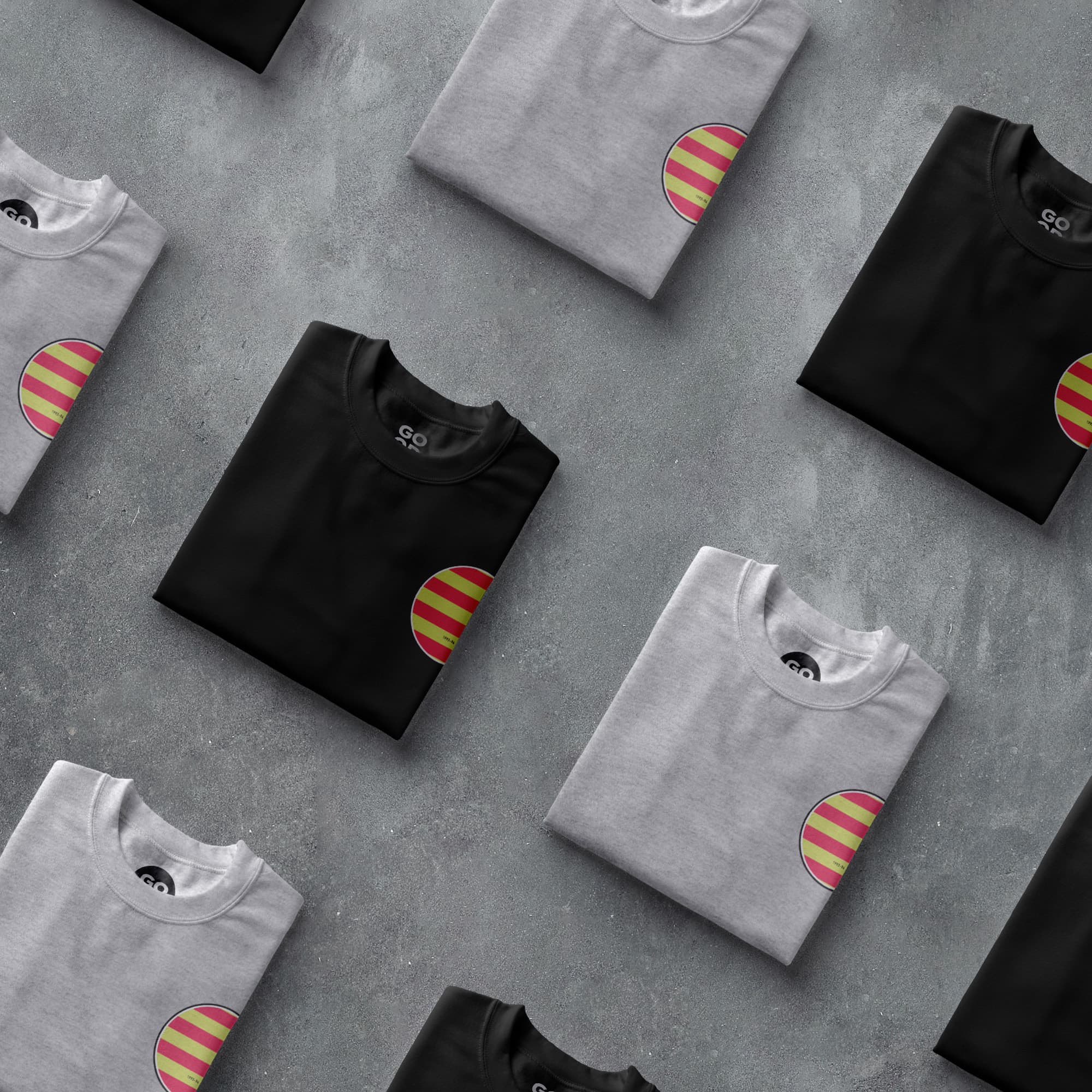 a group of black and white t - shirts with red and yellow stripes