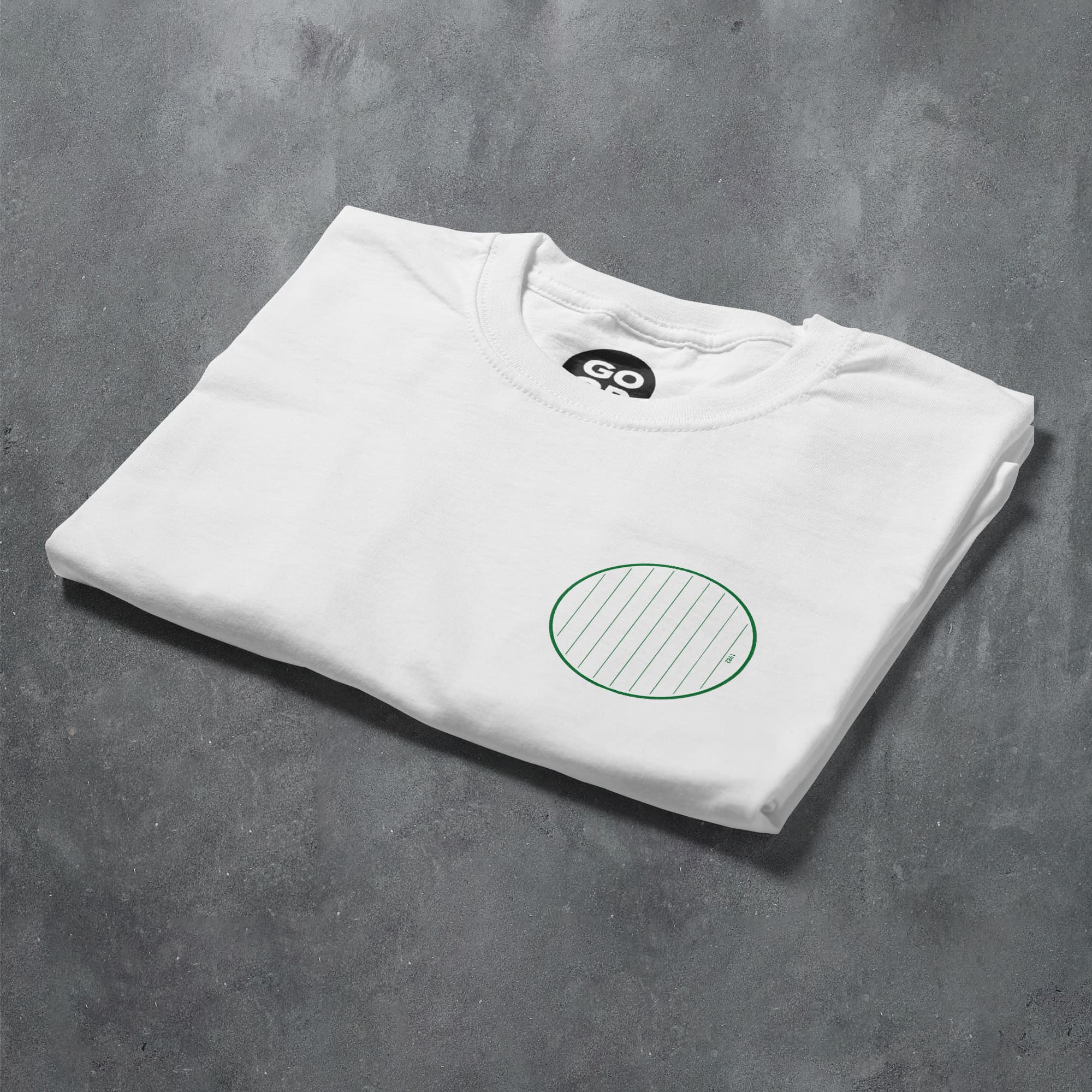 a white t - shirt with a green circle on it