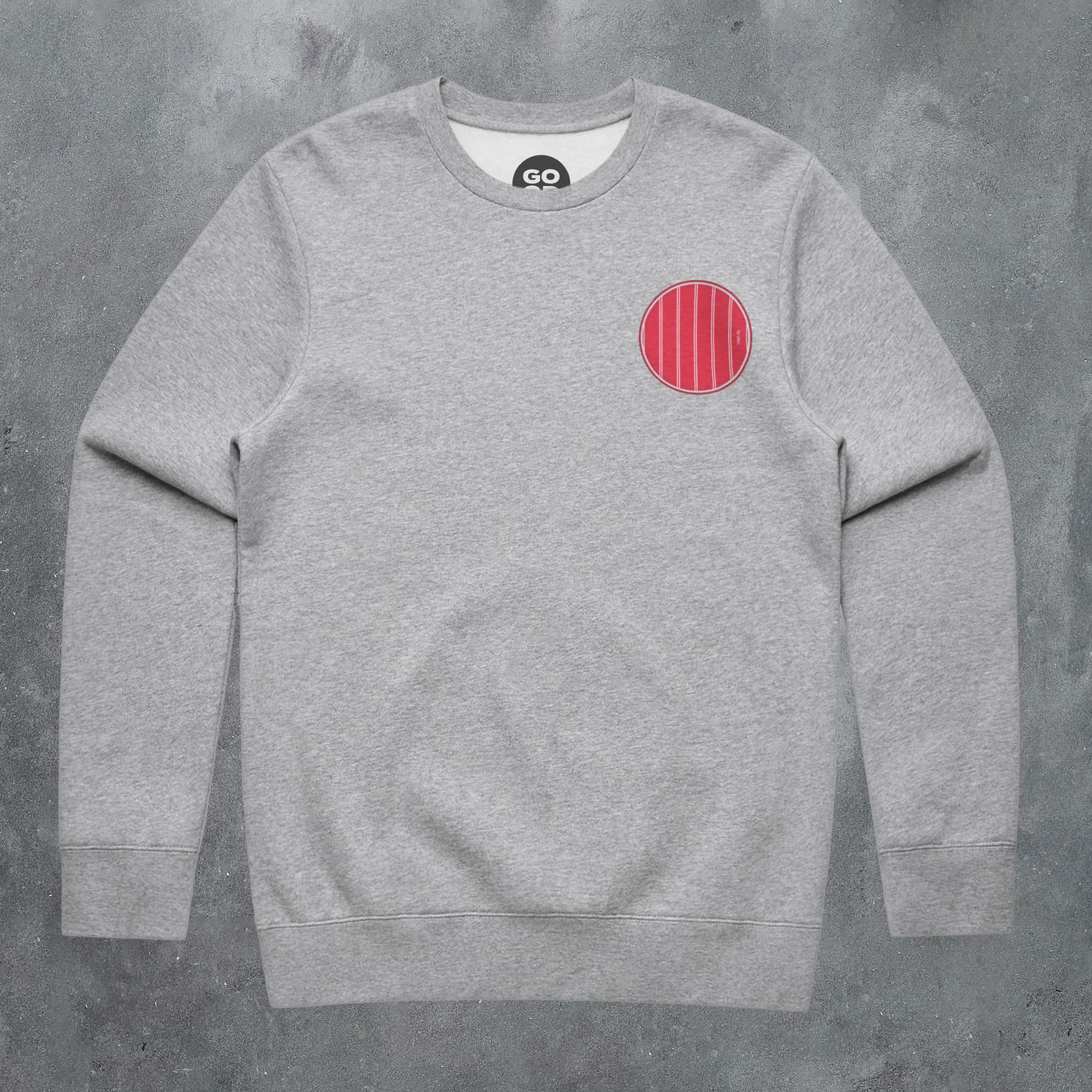a grey sweatshirt with a red circle on it