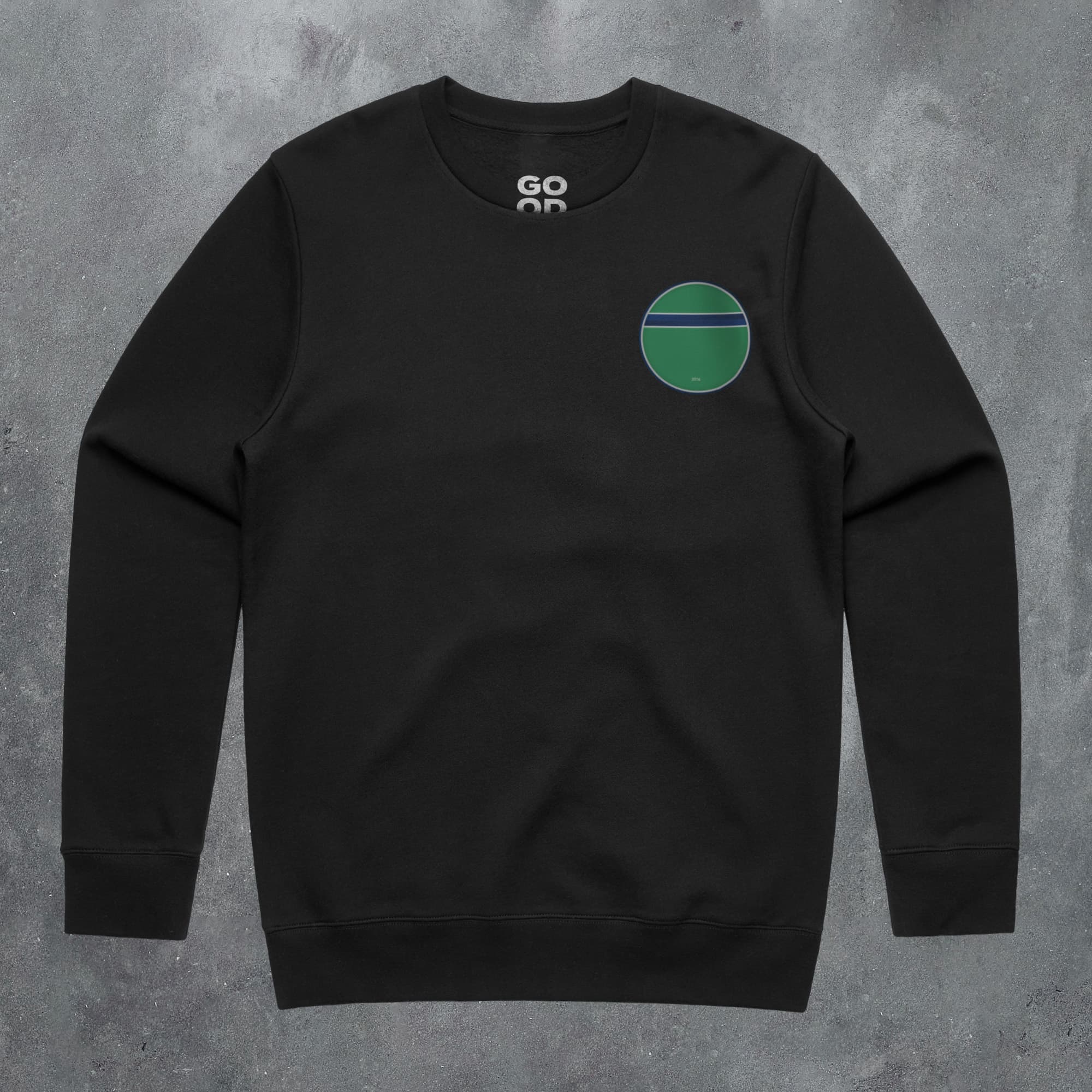 a black sweatshirt with a green circle on it