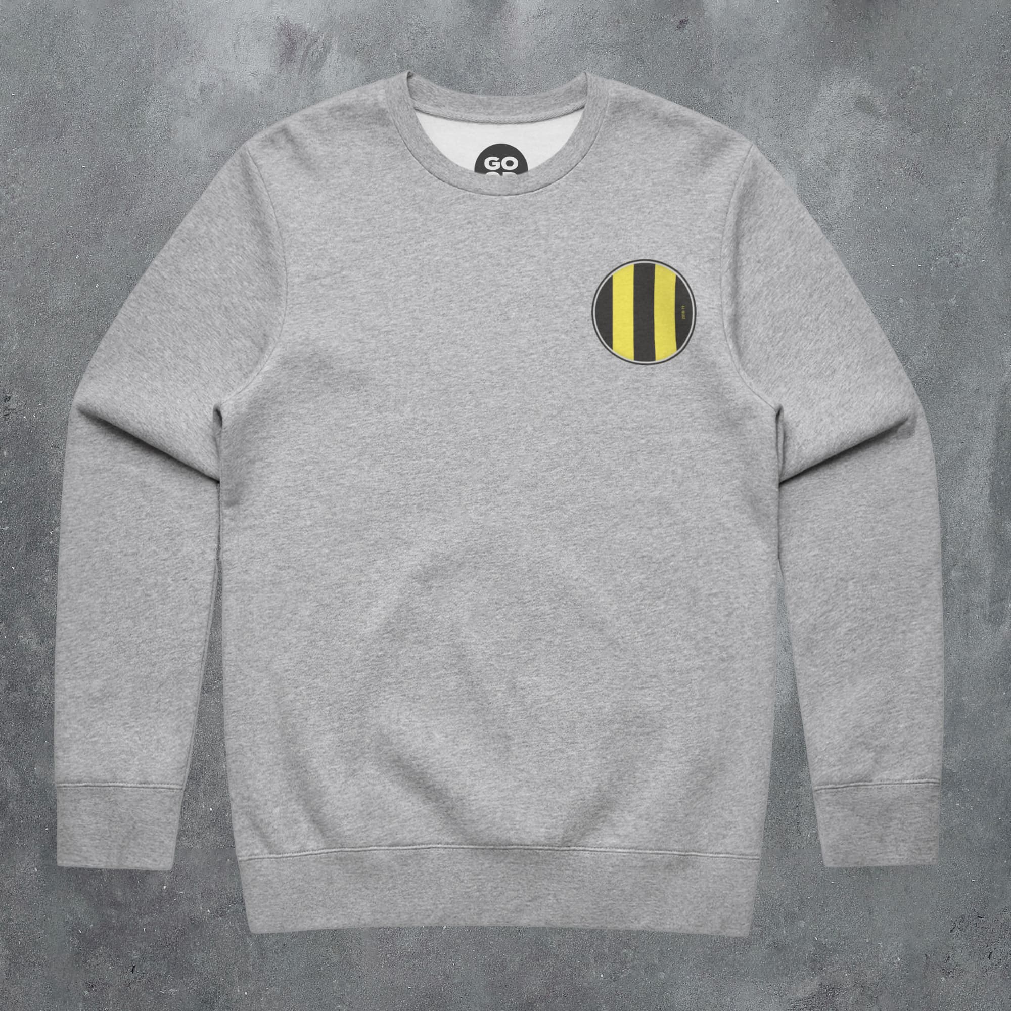 a grey sweatshirt with a yellow and black stripe on the chest