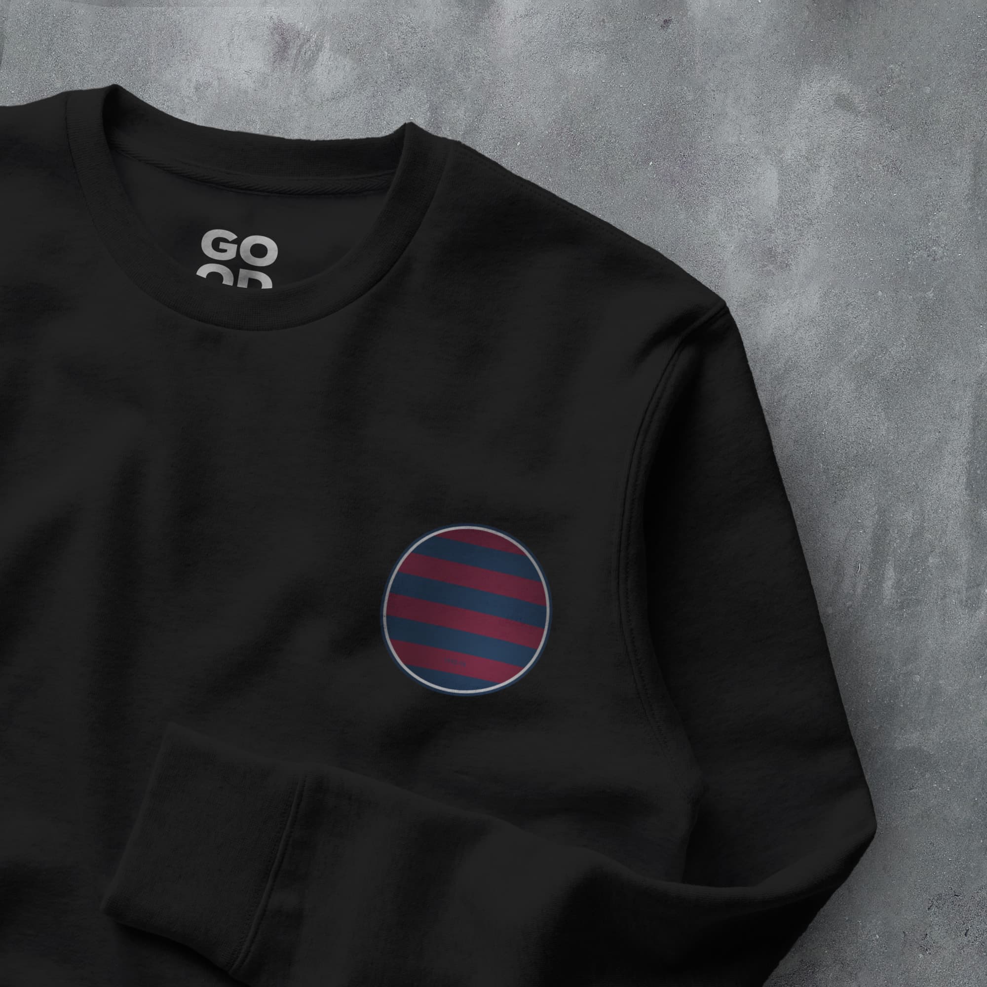 a black sweatshirt with a red and blue circle on it