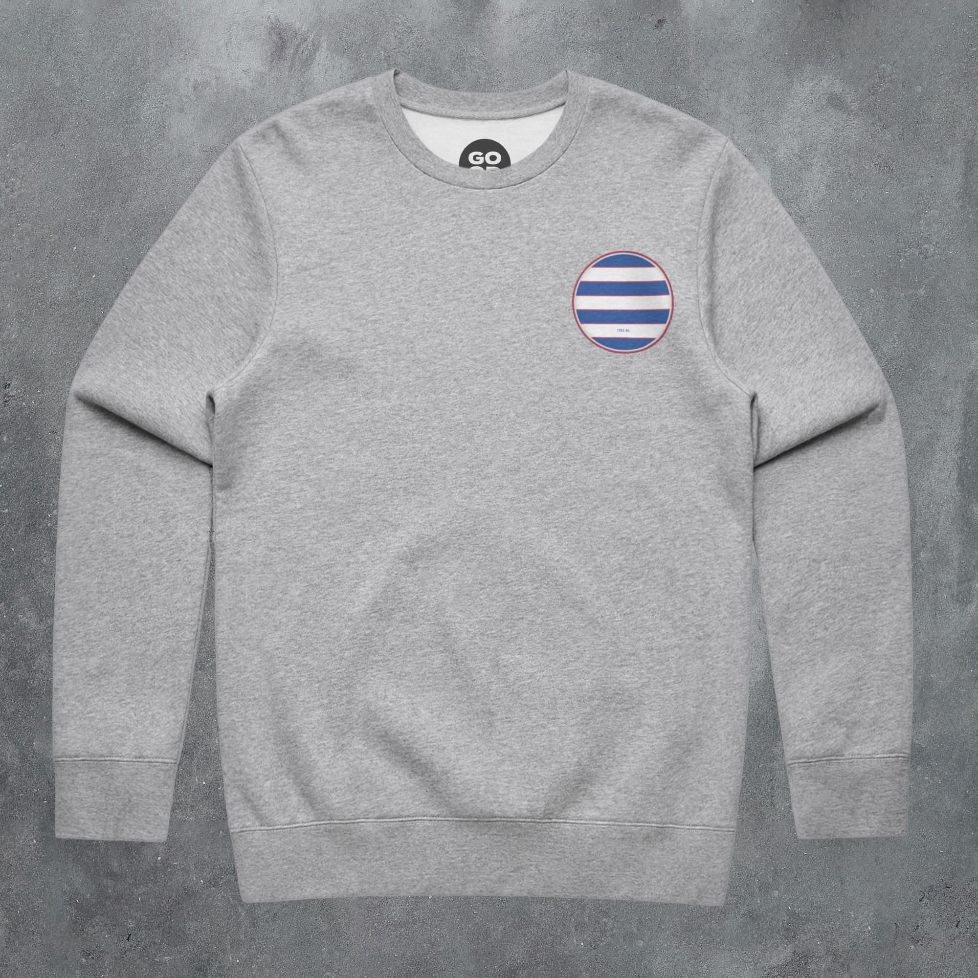a grey sweatshirt with a blue and white stripe on the chest