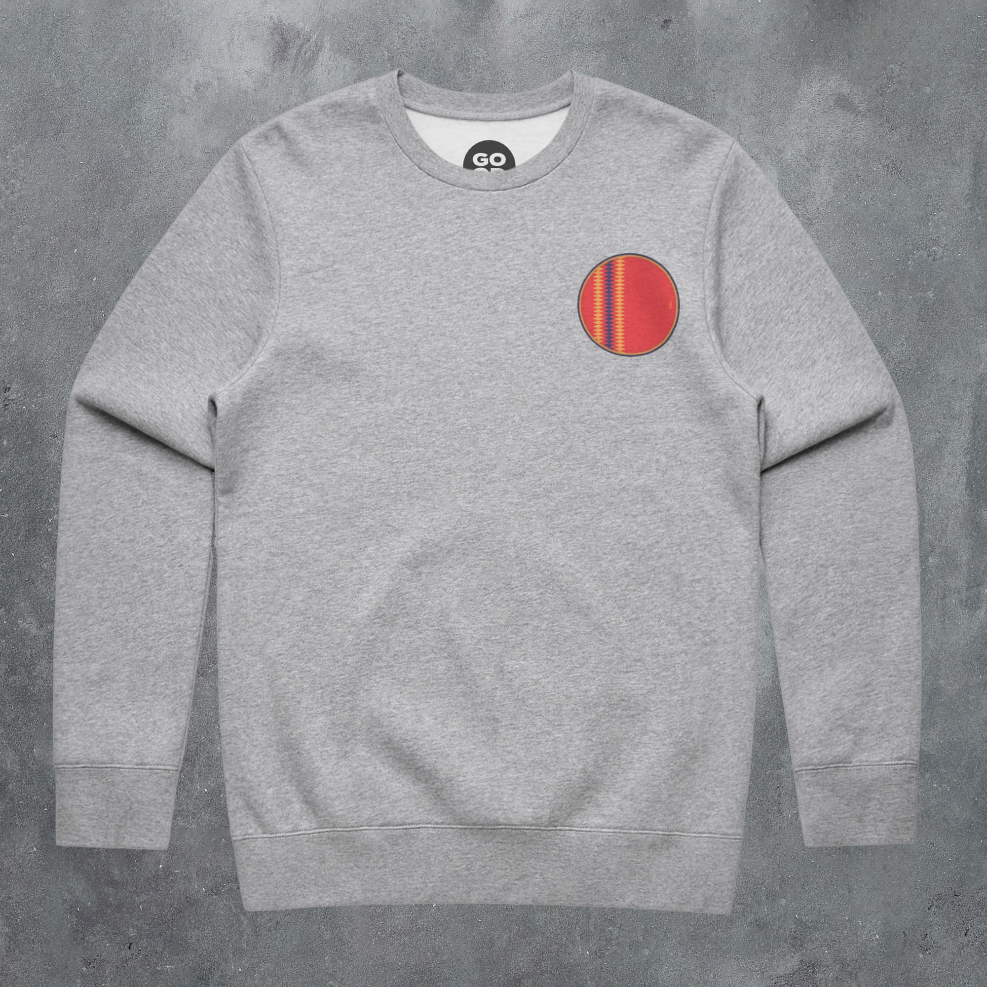 a grey sweatshirt with a red circle on it