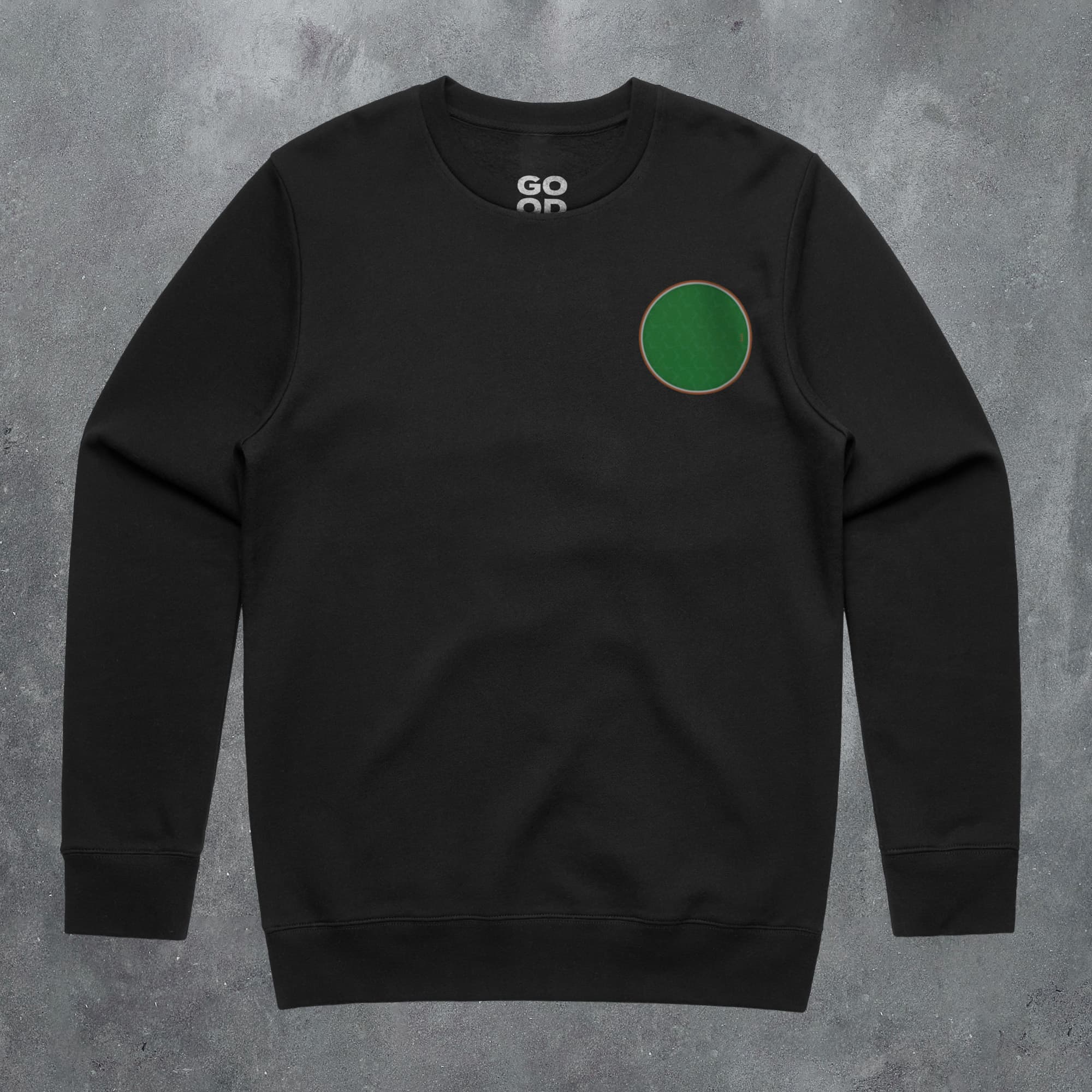 a black sweatshirt with a green circle on it