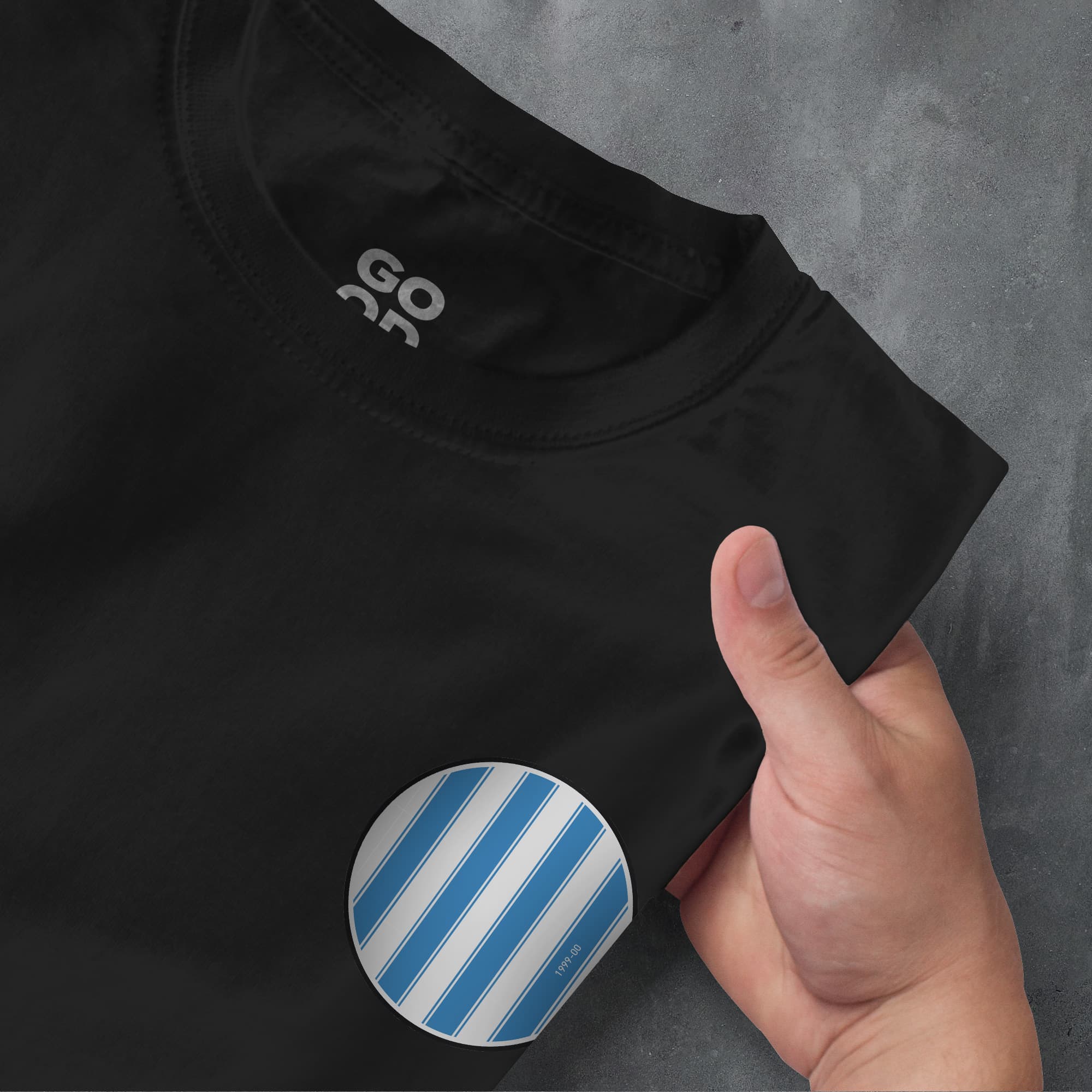 a person holding a blue and white striped sticker