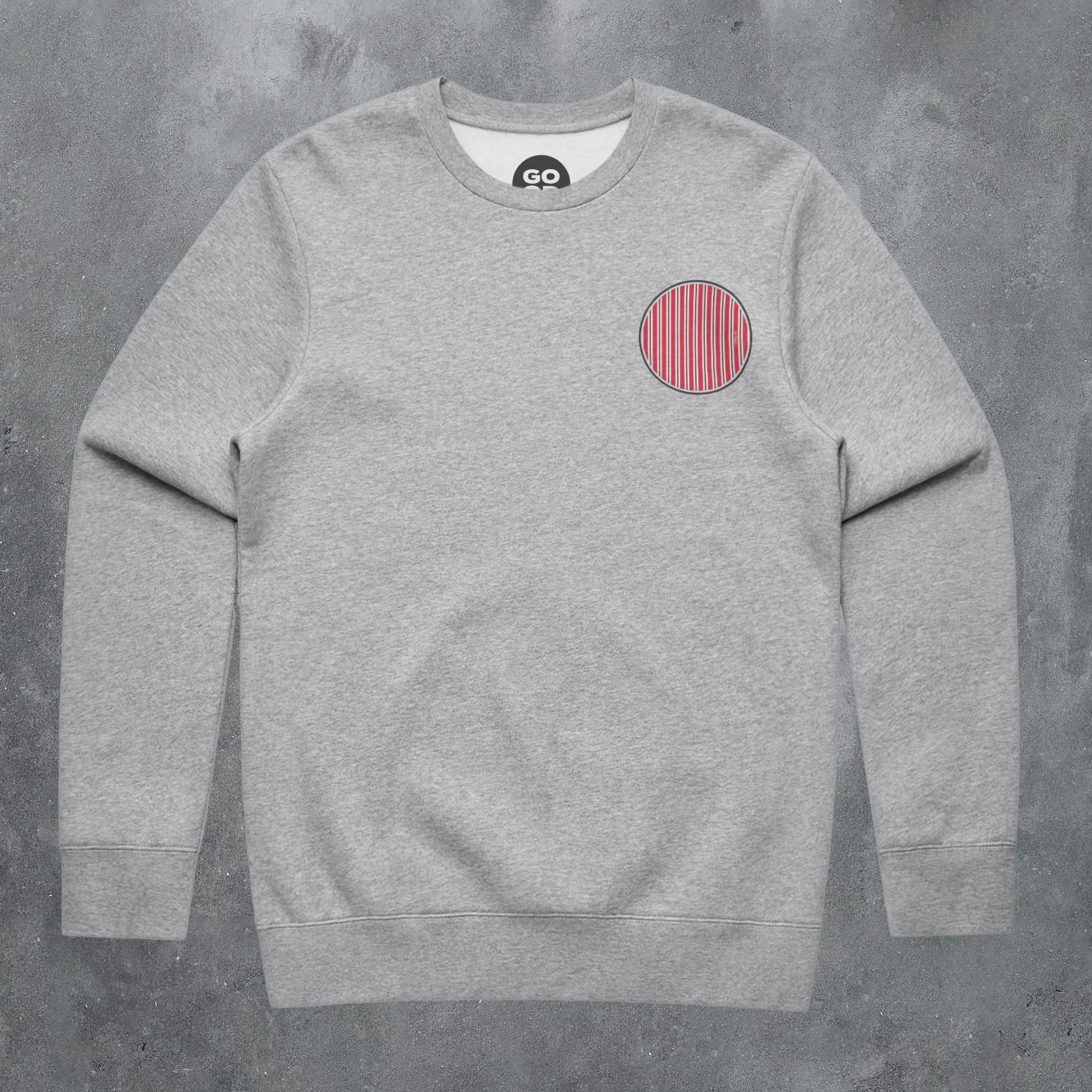 a grey sweatshirt with a red circle on it