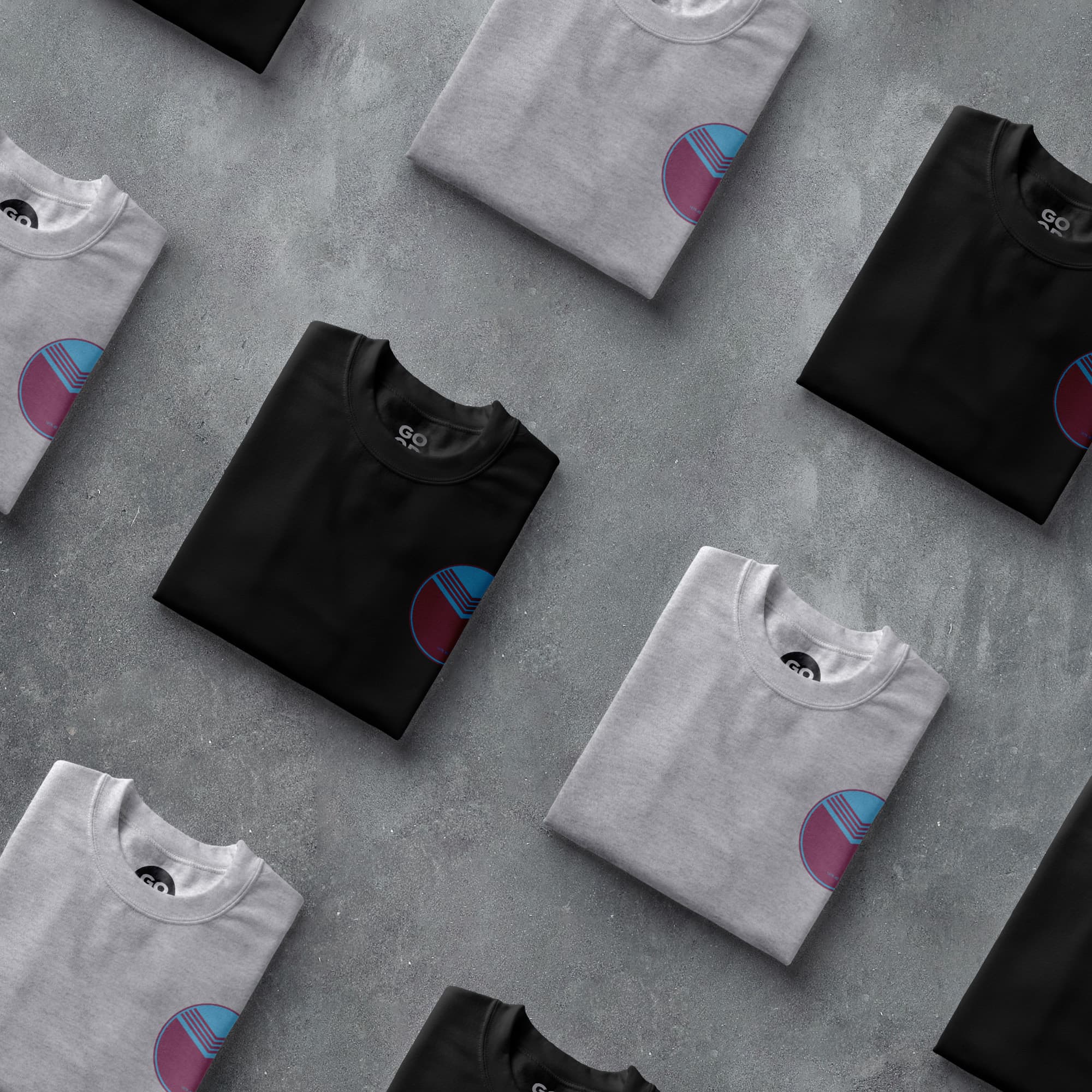 a group of black and white t - shirts sitting on top of each other