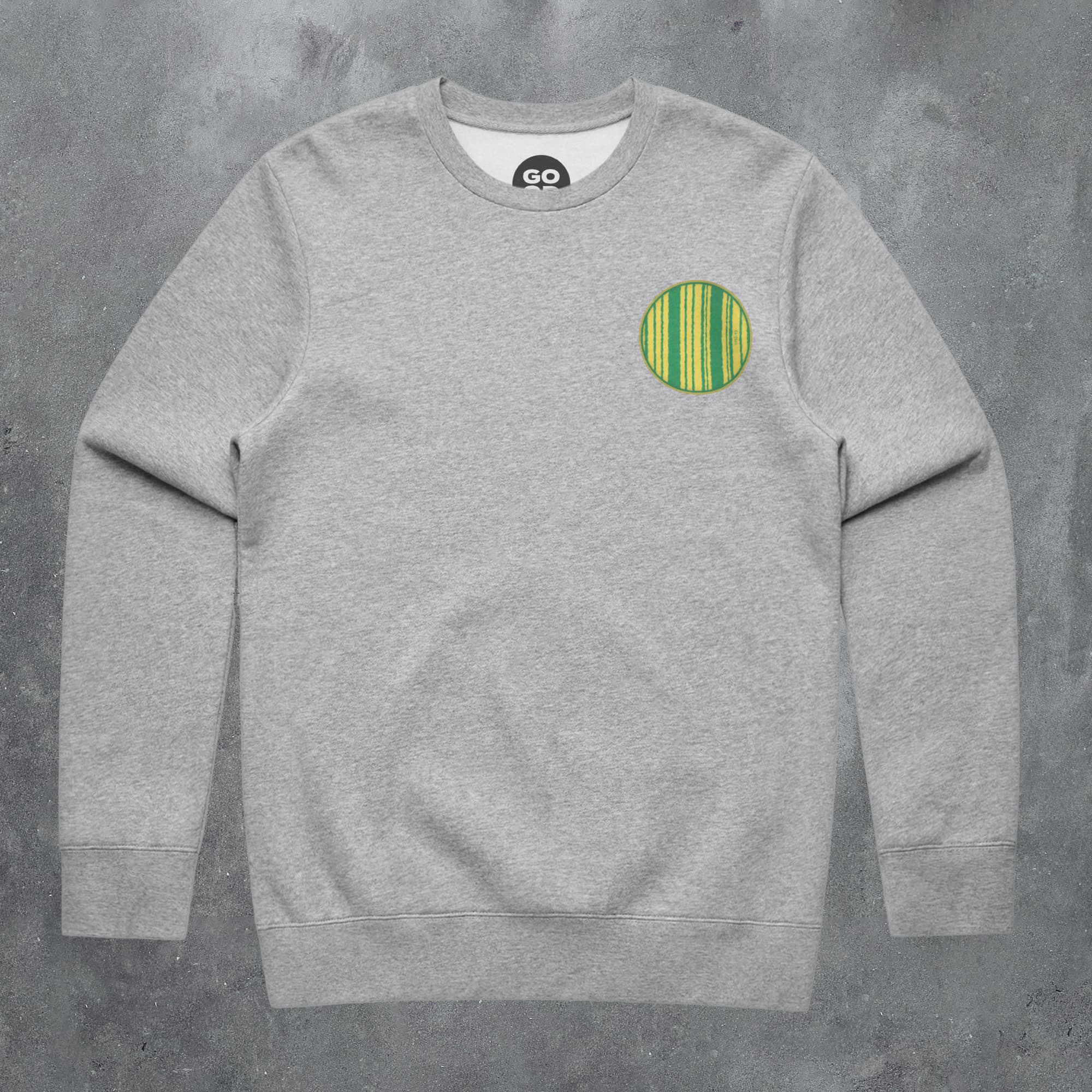 a grey sweatshirt with a green circle on the front