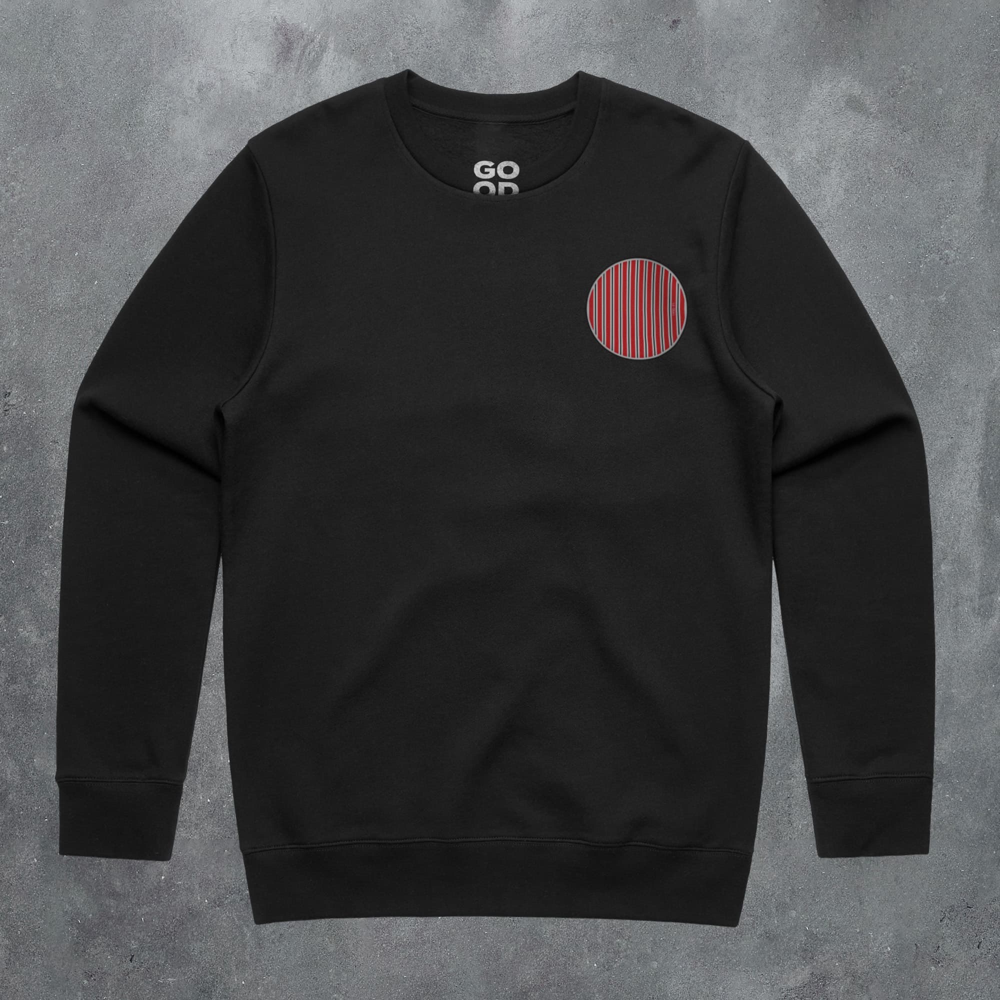 a black sweatshirt with a red circle on it