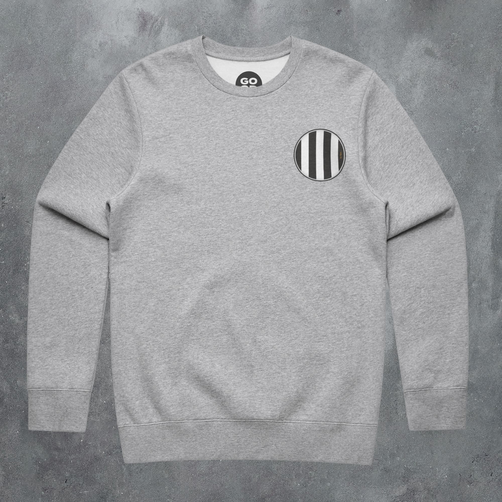 a grey sweatshirt with black and white stripes on it