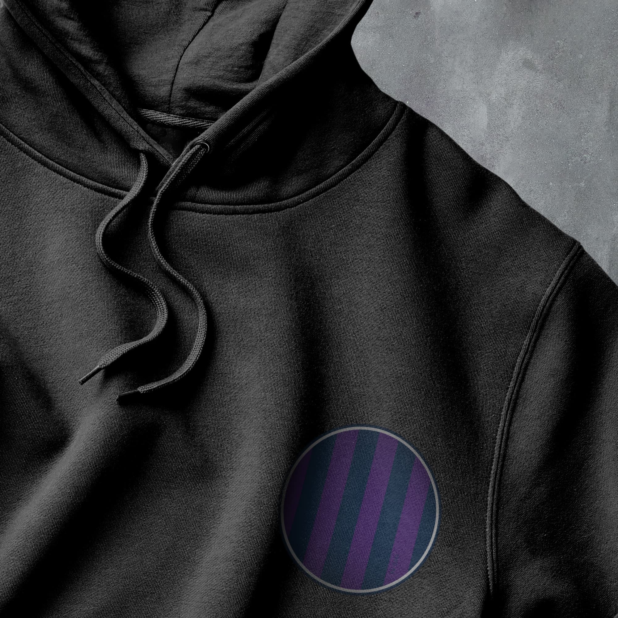 a black hoodie with a purple stripe on it