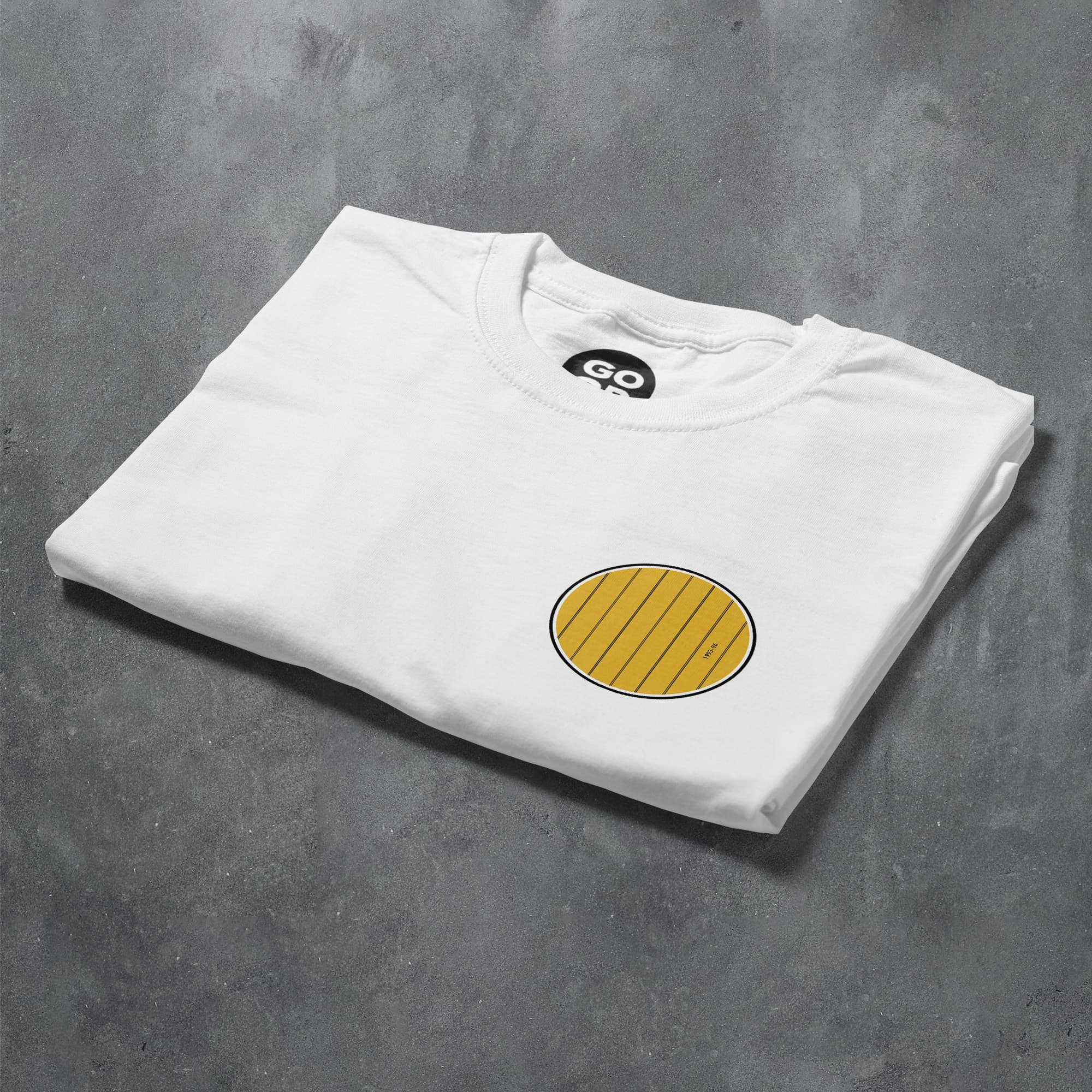 a white t - shirt with a yellow circle on it