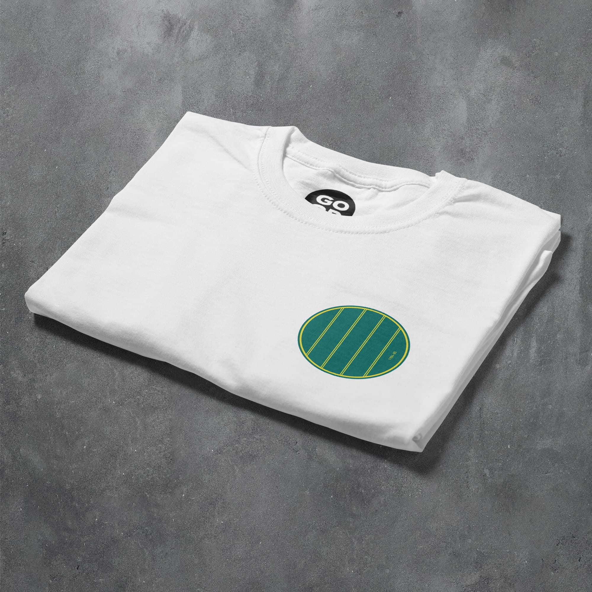 a white t - shirt with a green circle on it