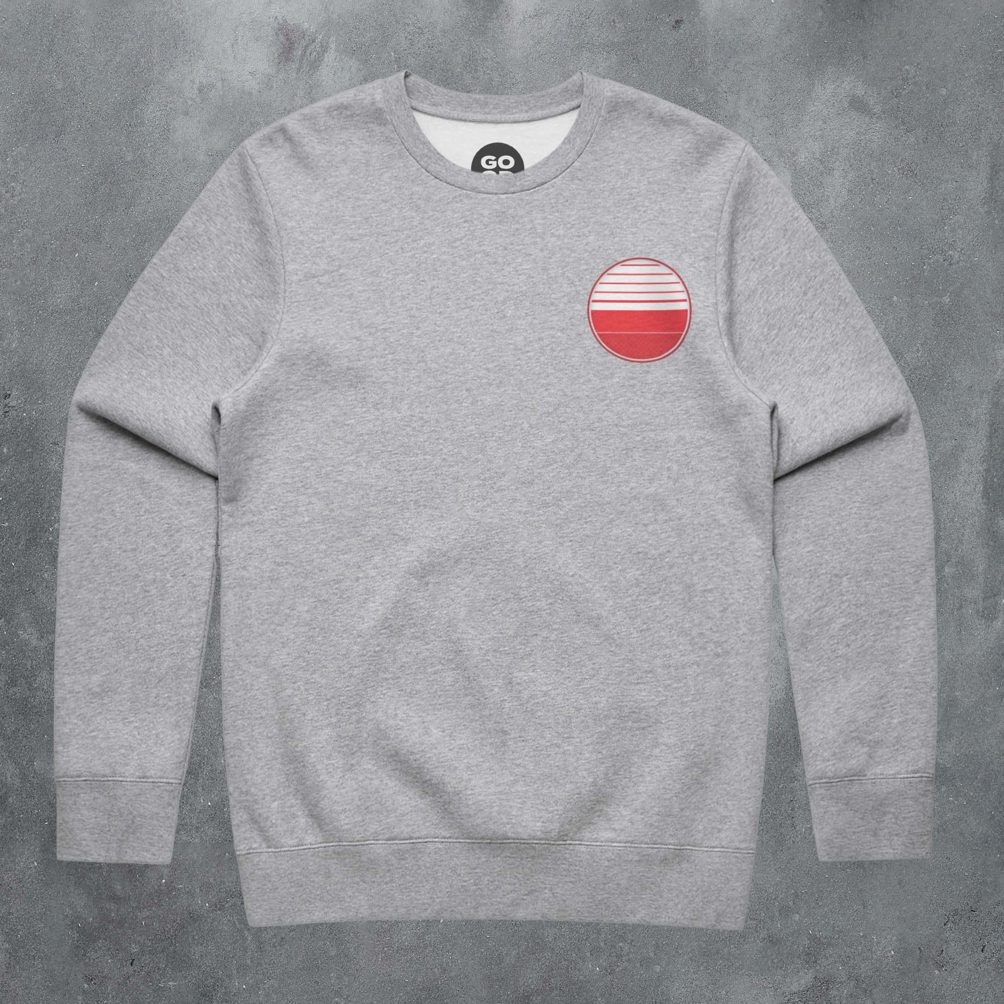 a grey sweatshirt with a red circle on the chest