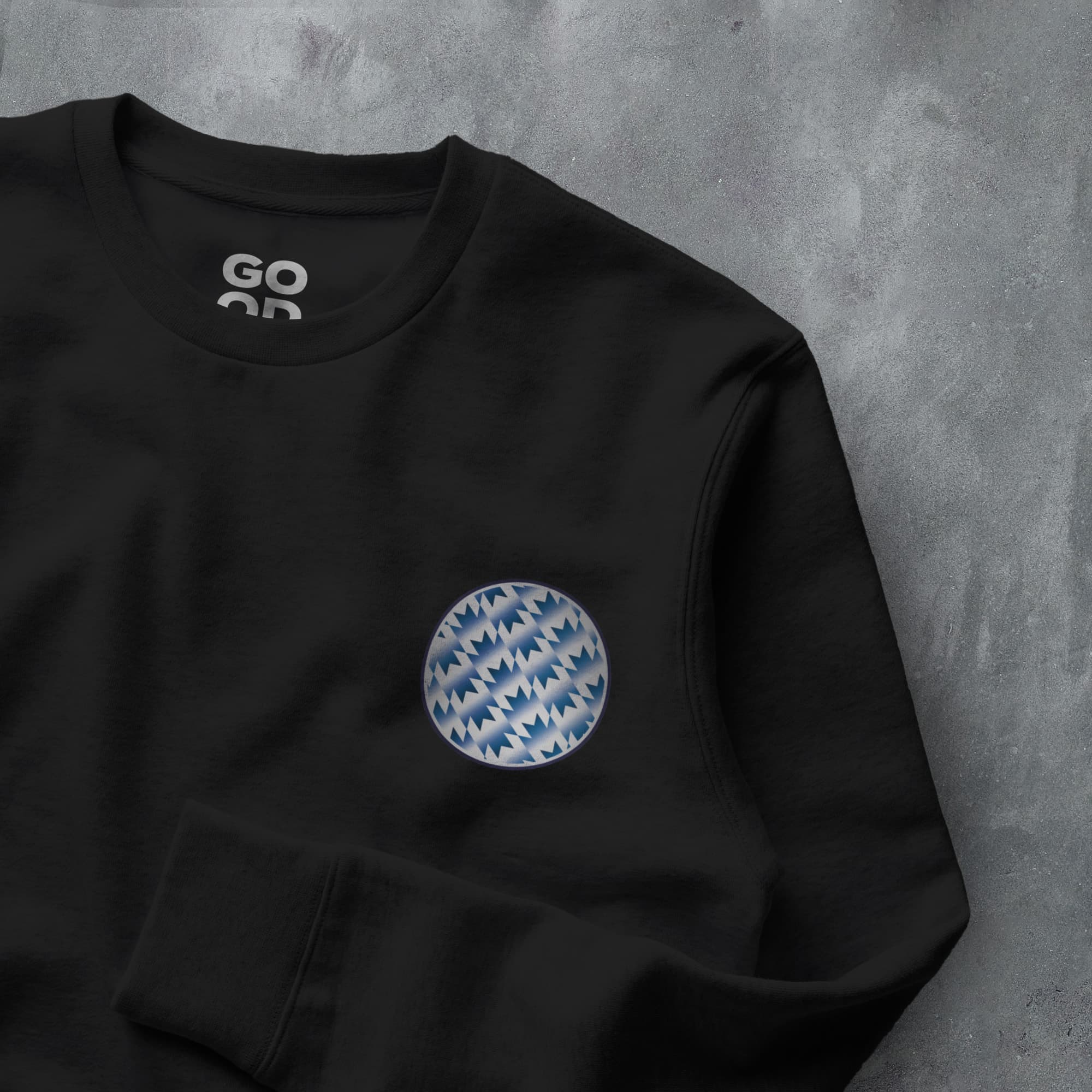 a black sweatshirt with a blue and white pattern on it