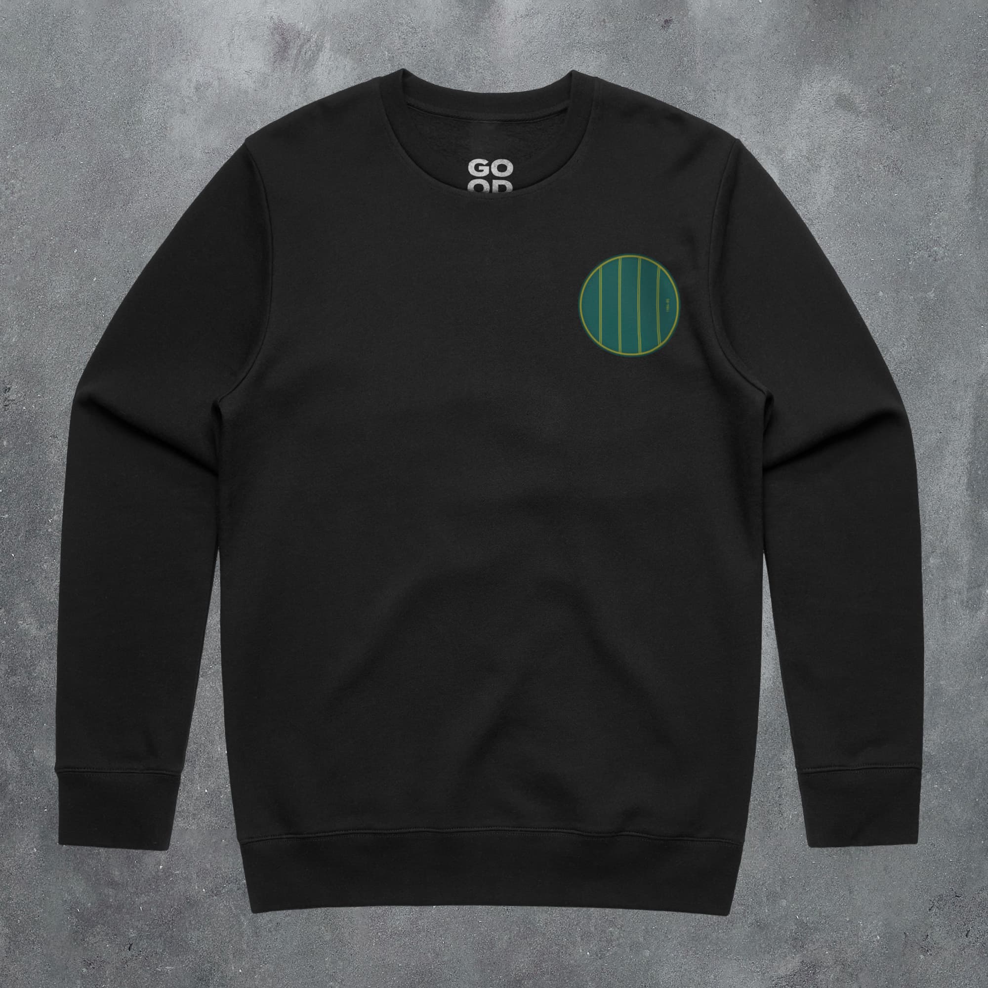 a black sweatshirt with a green circle on it