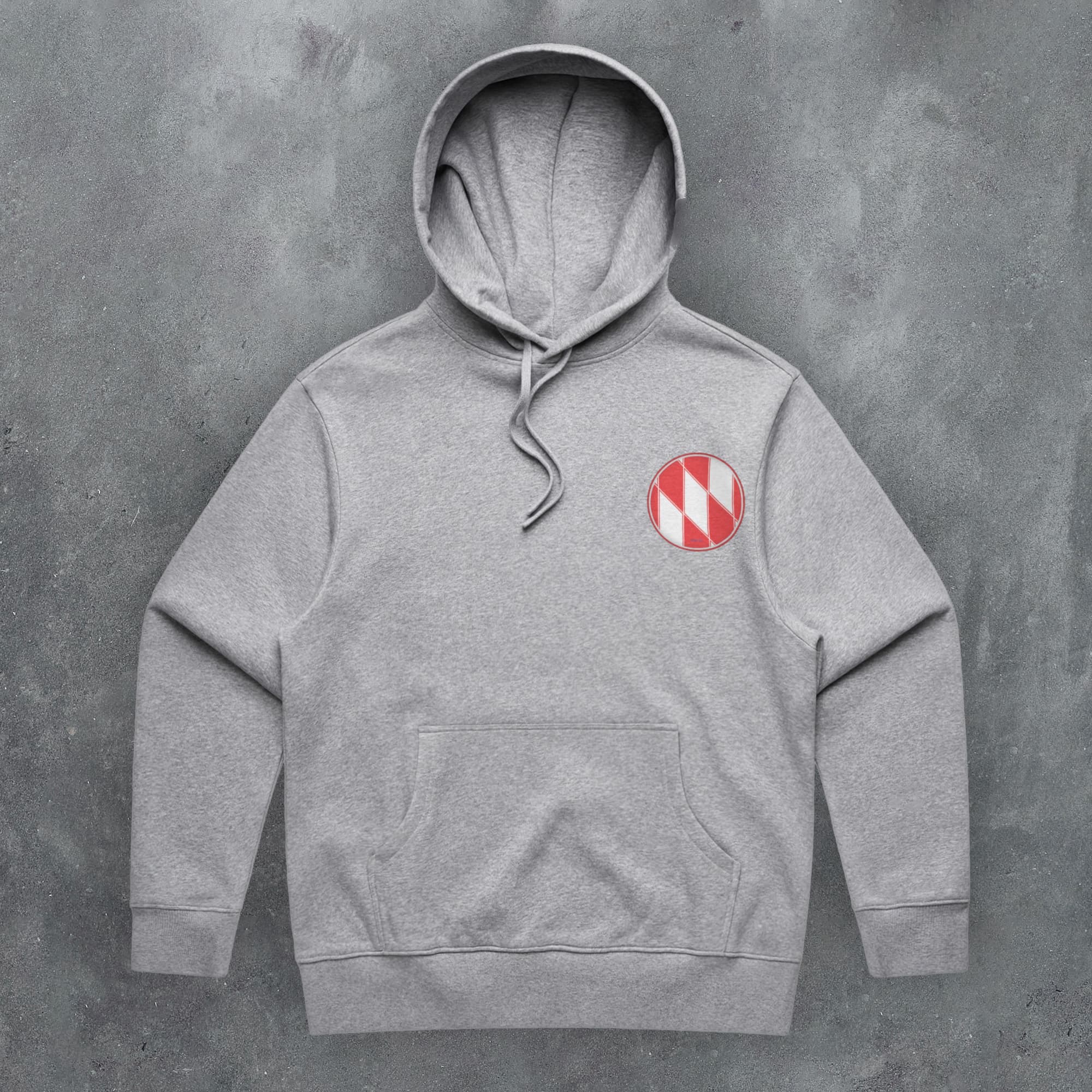 a grey hoodie with a red and white checkered button on it