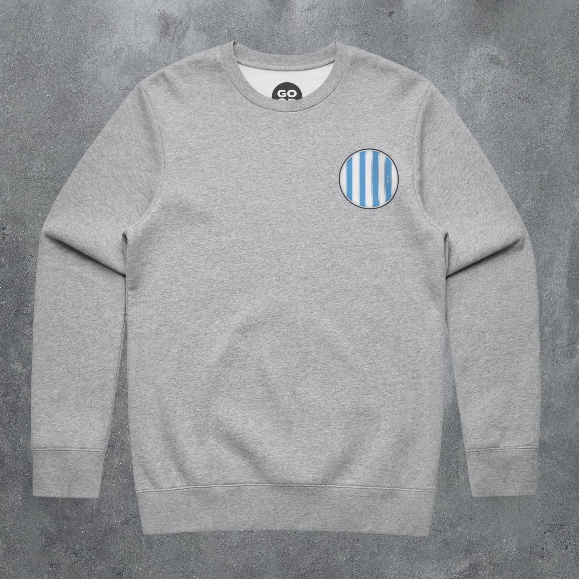 a grey sweatshirt with a blue and white stripe on the chest