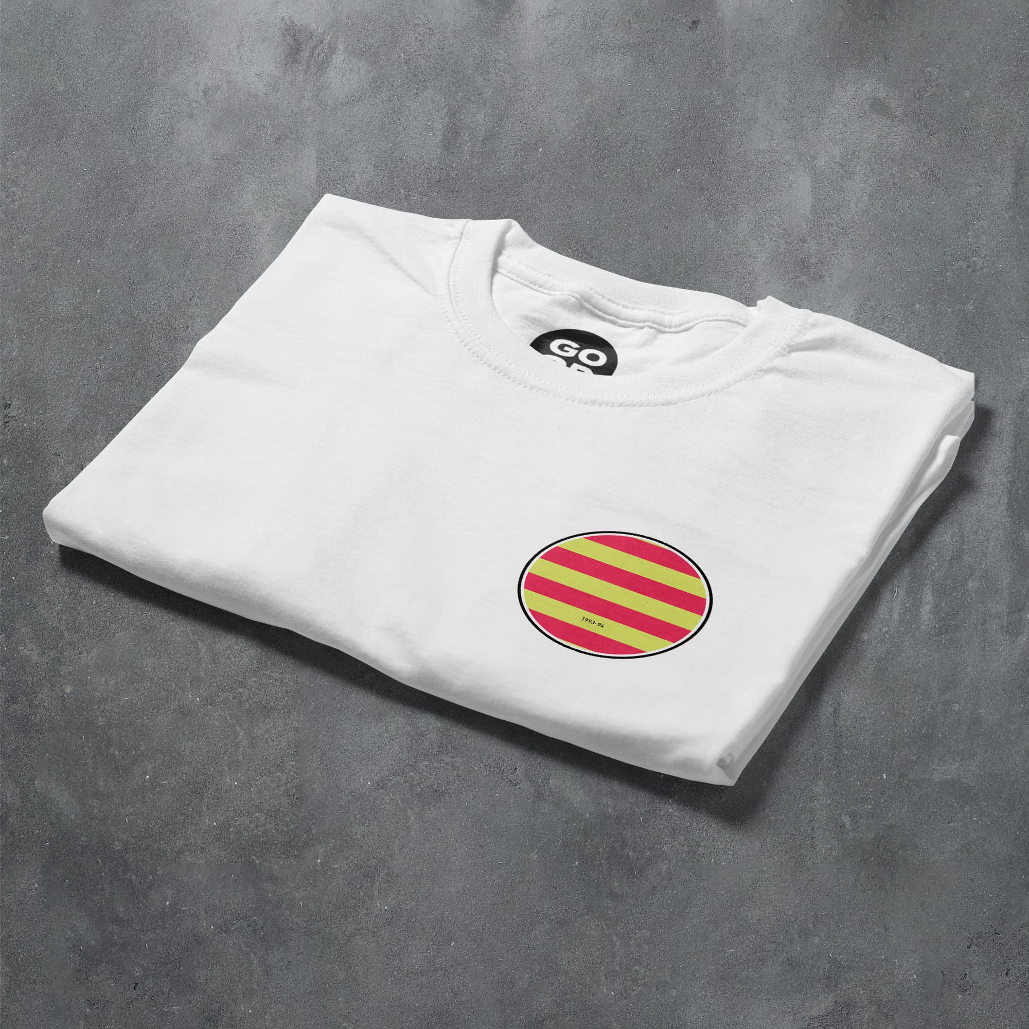 a white t - shirt with a red and yellow striped circle on it