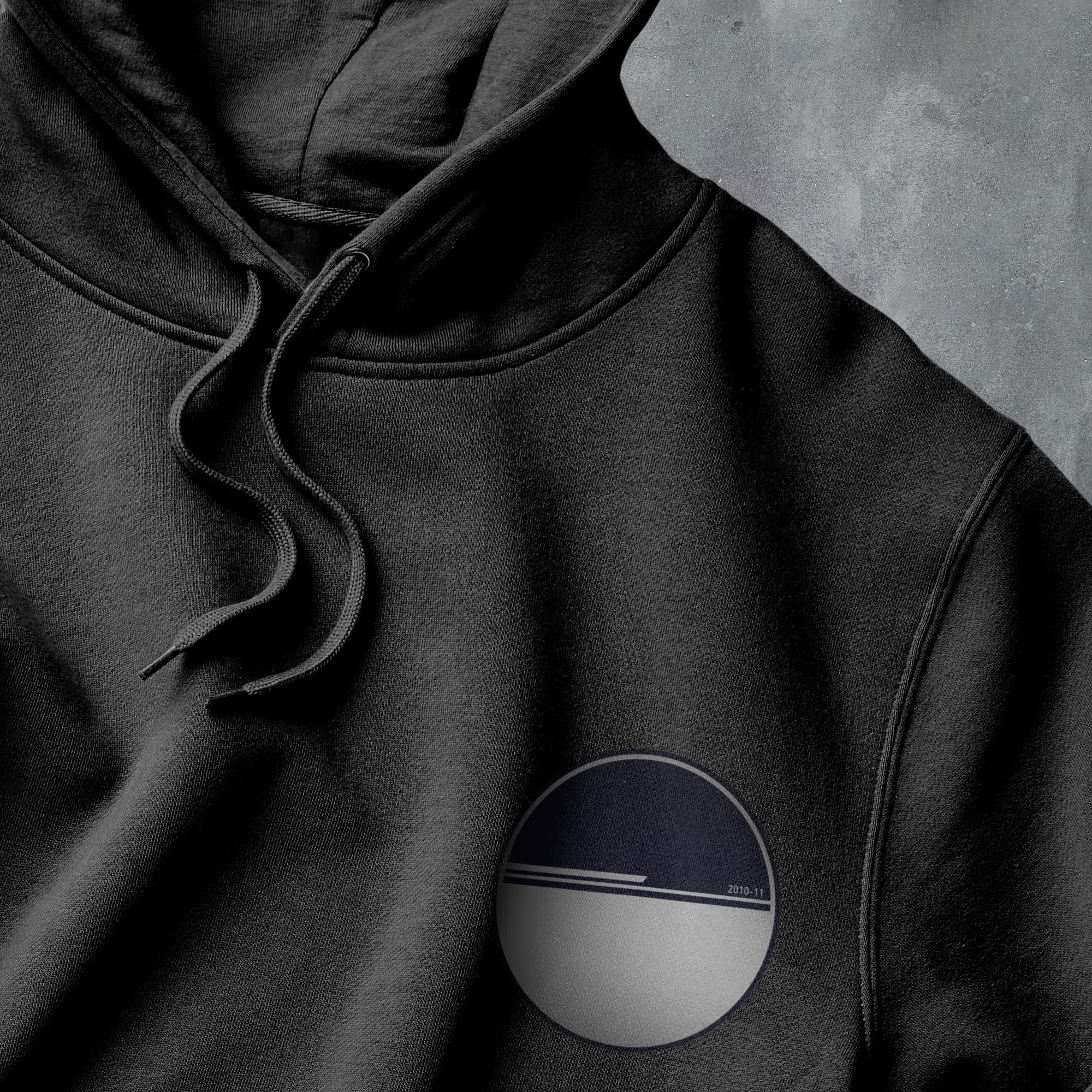 a black hoodie with a white circle on it