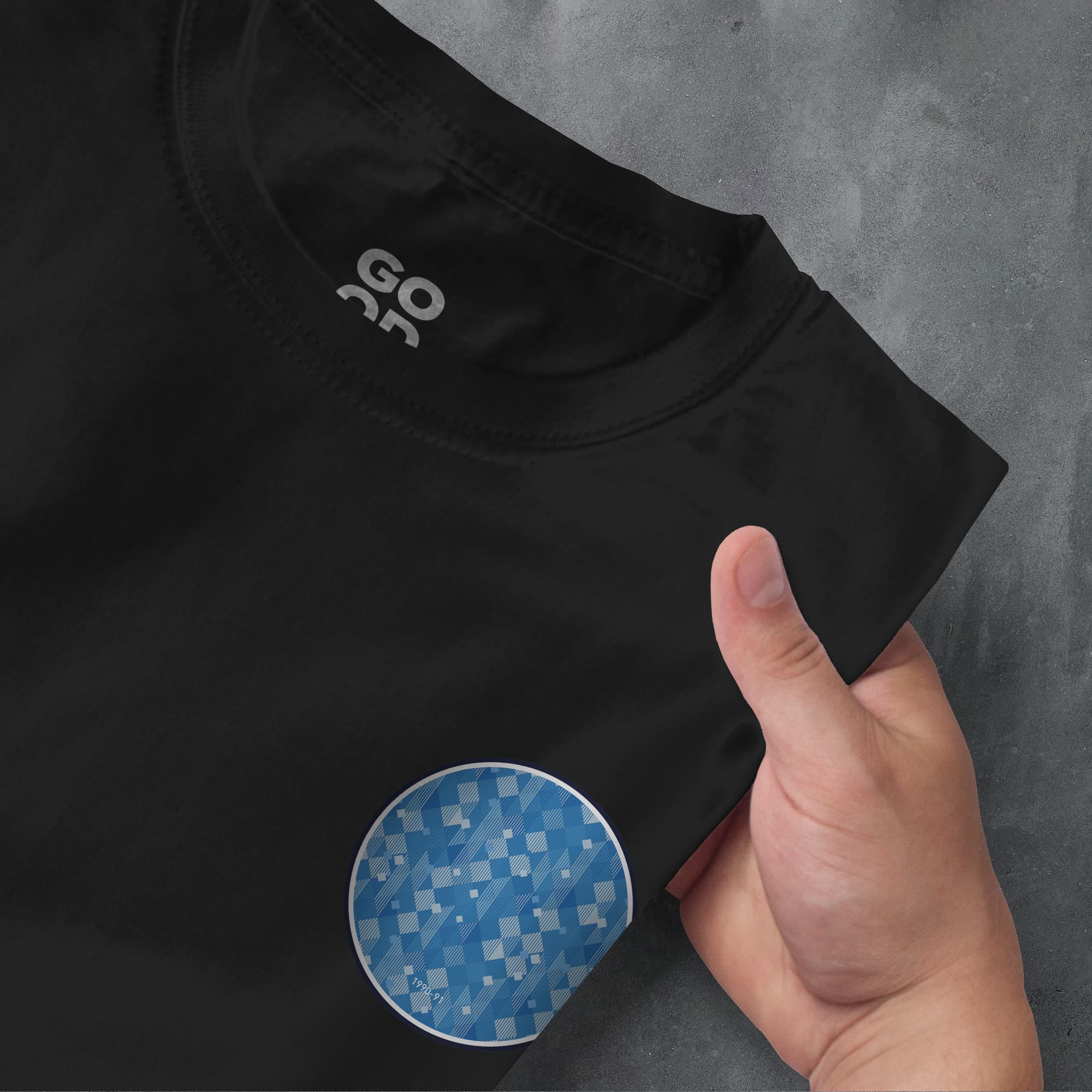 a person holding a blue and white checkered plate
