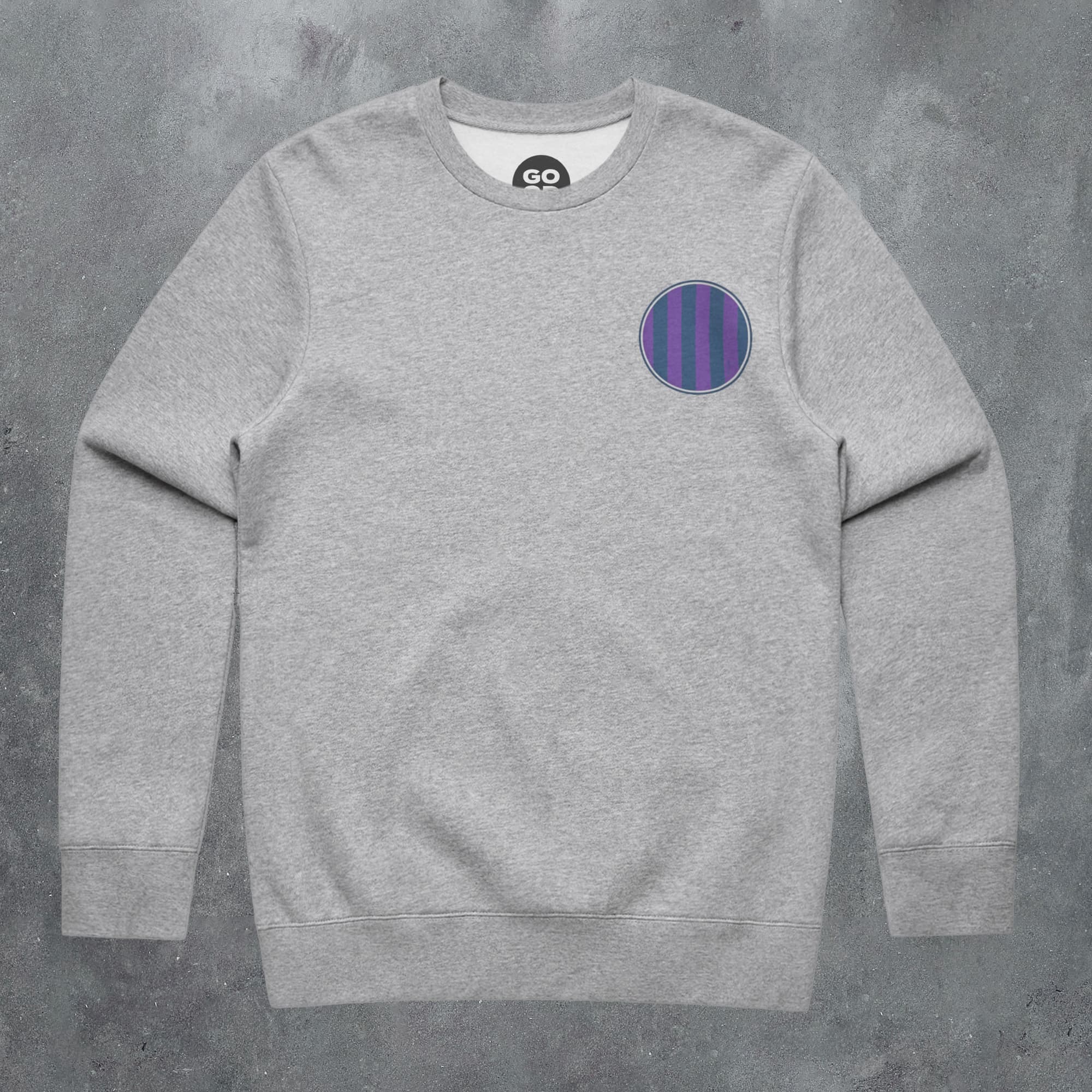 a grey sweatshirt with a purple circle on the front