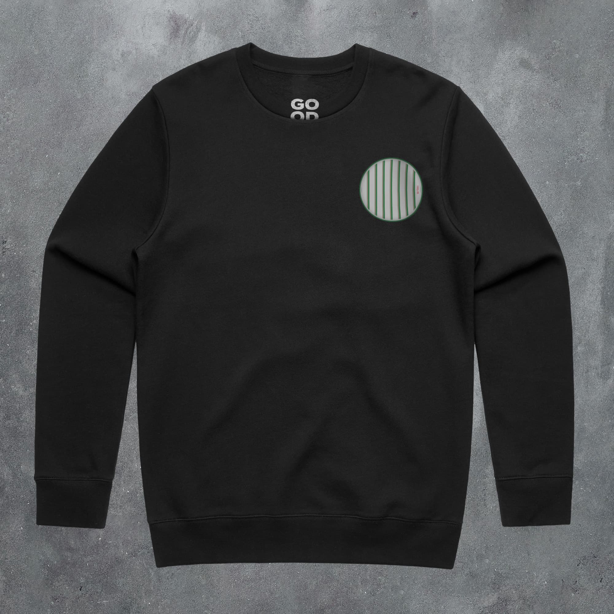 a black sweatshirt with a green circle on it