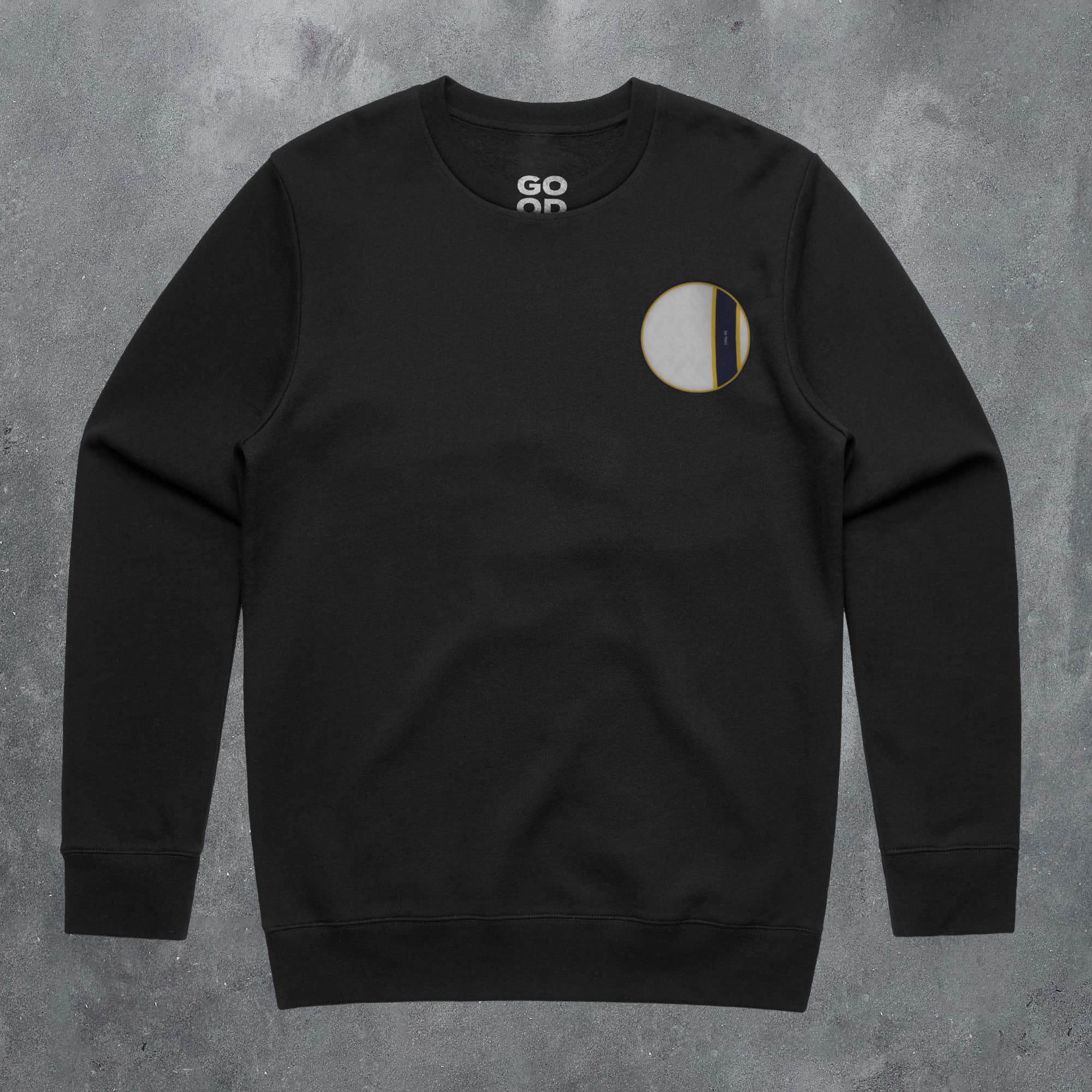 a black sweatshirt with a white circle on the front