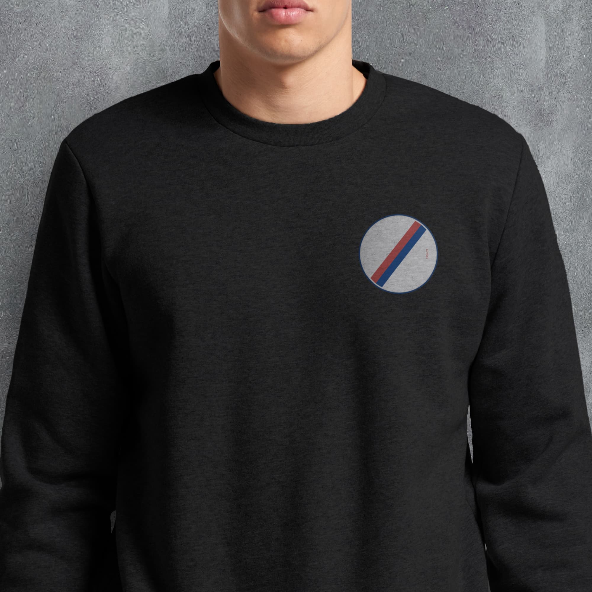 a man wearing a black sweatshirt with a bmw logo on it