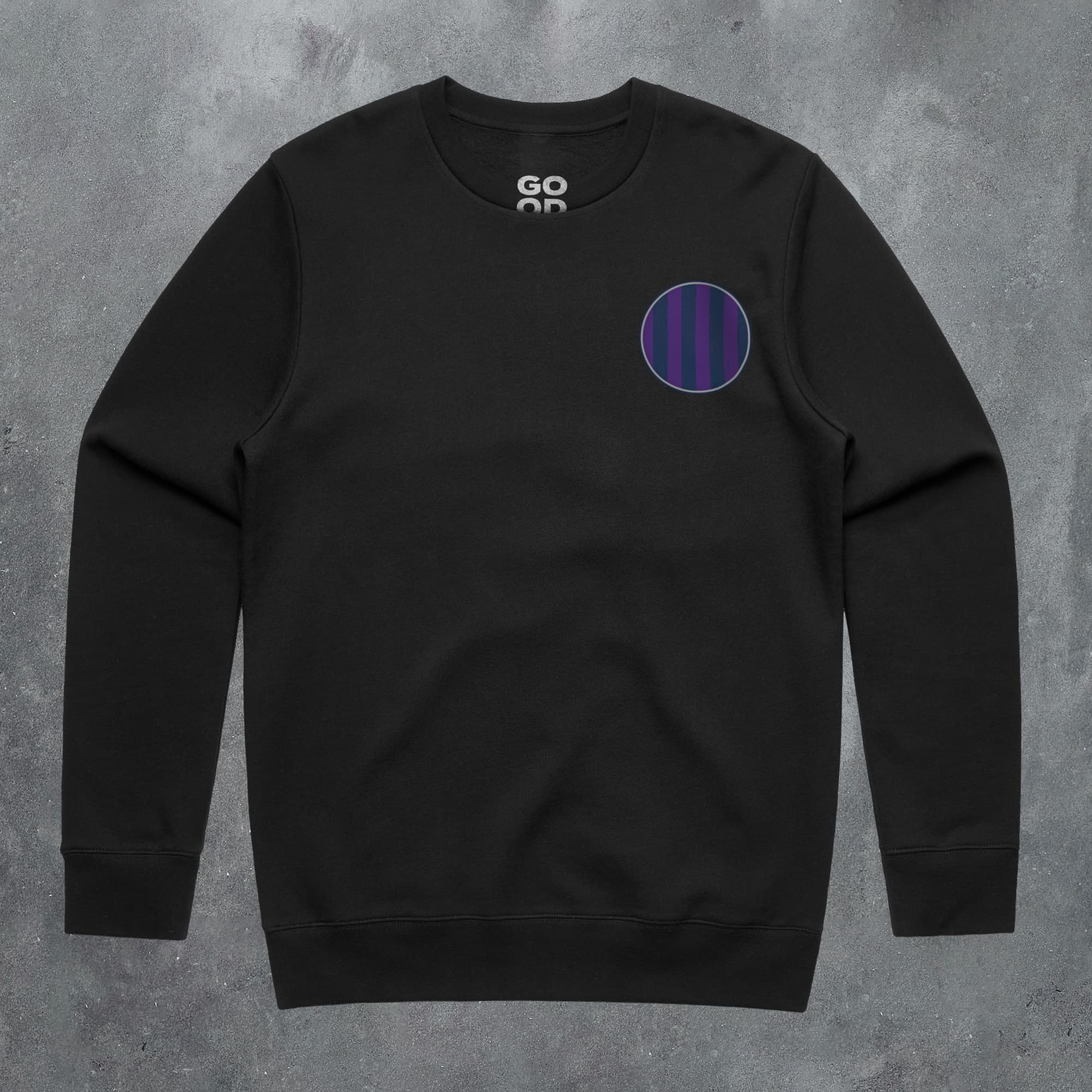 a black sweatshirt with a purple circle on it