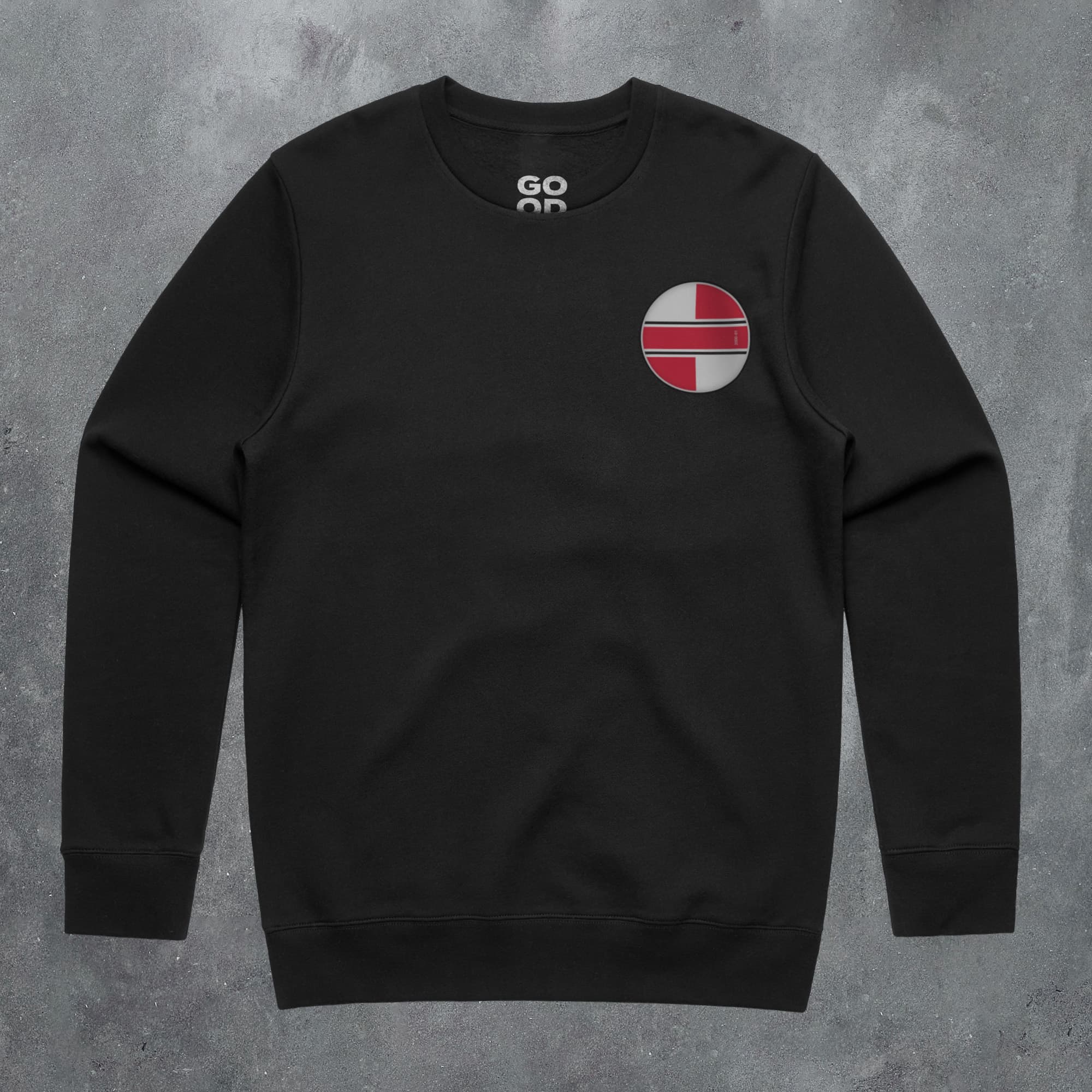 a black sweatshirt with a red and white circle on it