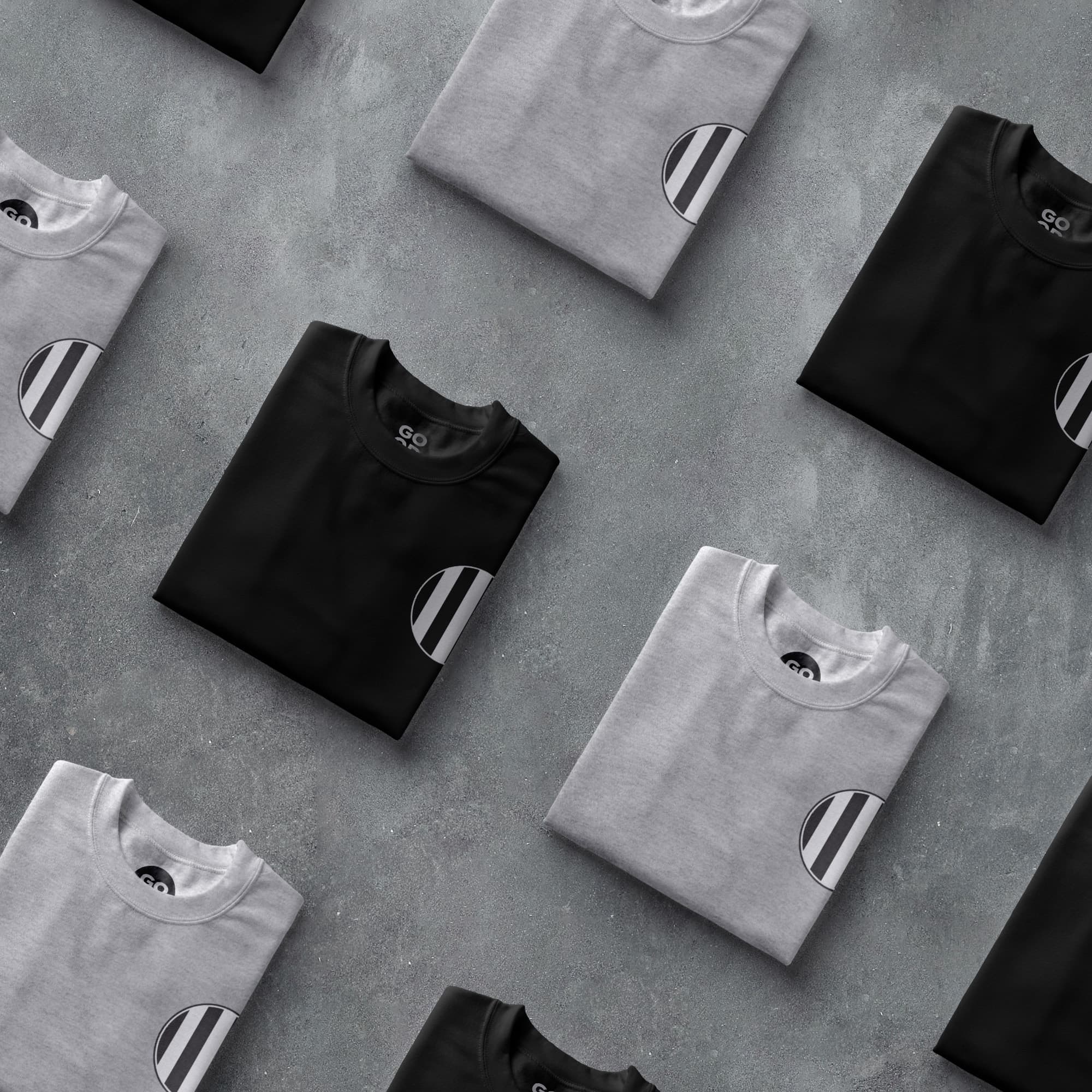 a group of black and white shirts sitting on top of a table