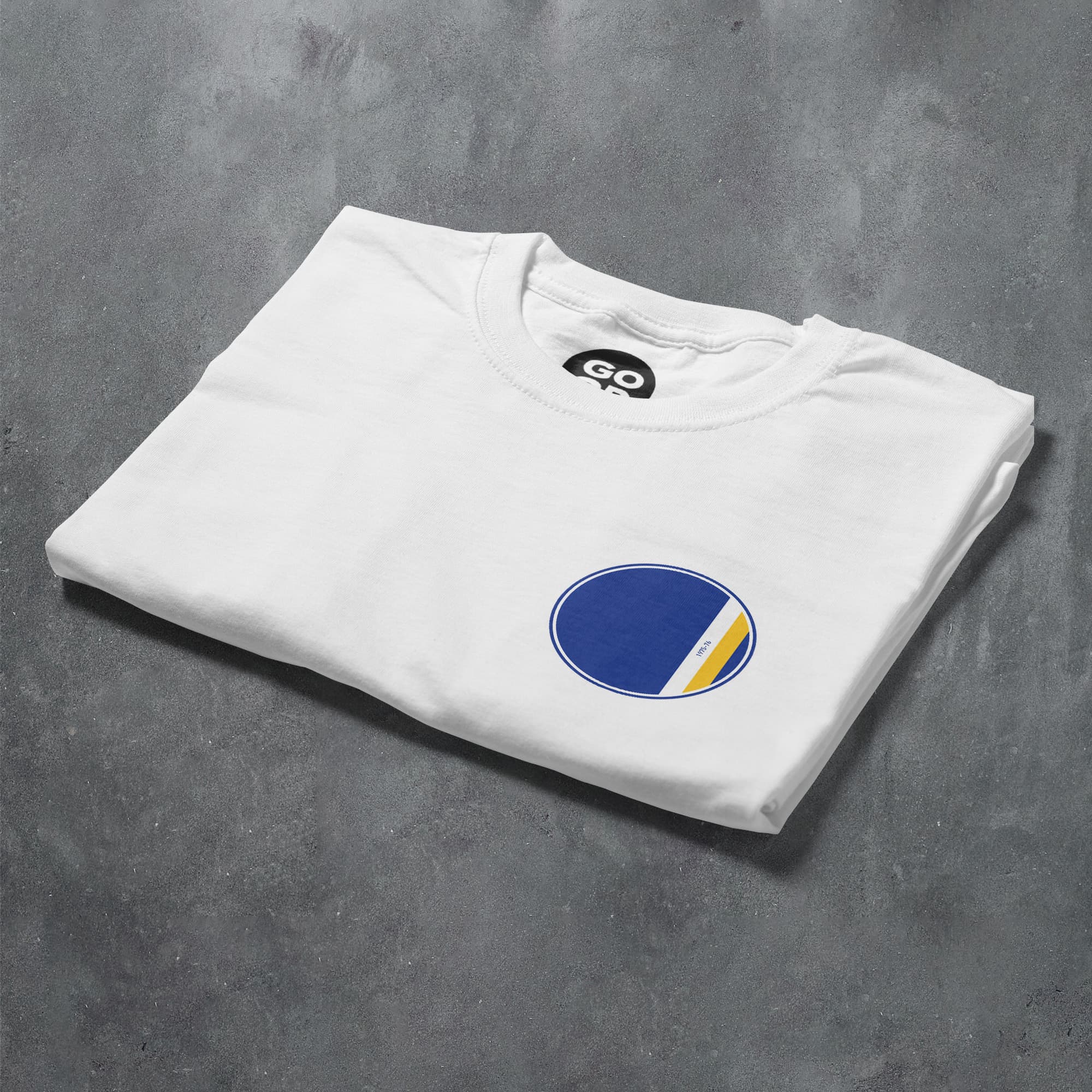 a white t - shirt with a blue and yellow circle on it