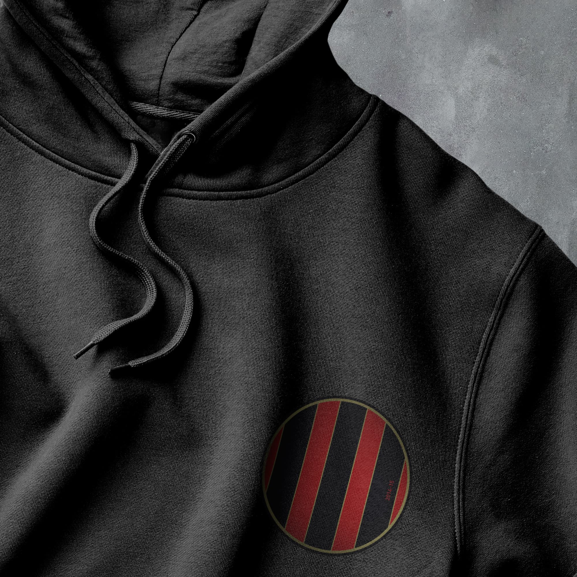 a black hoodie with a red and black stripe on it
