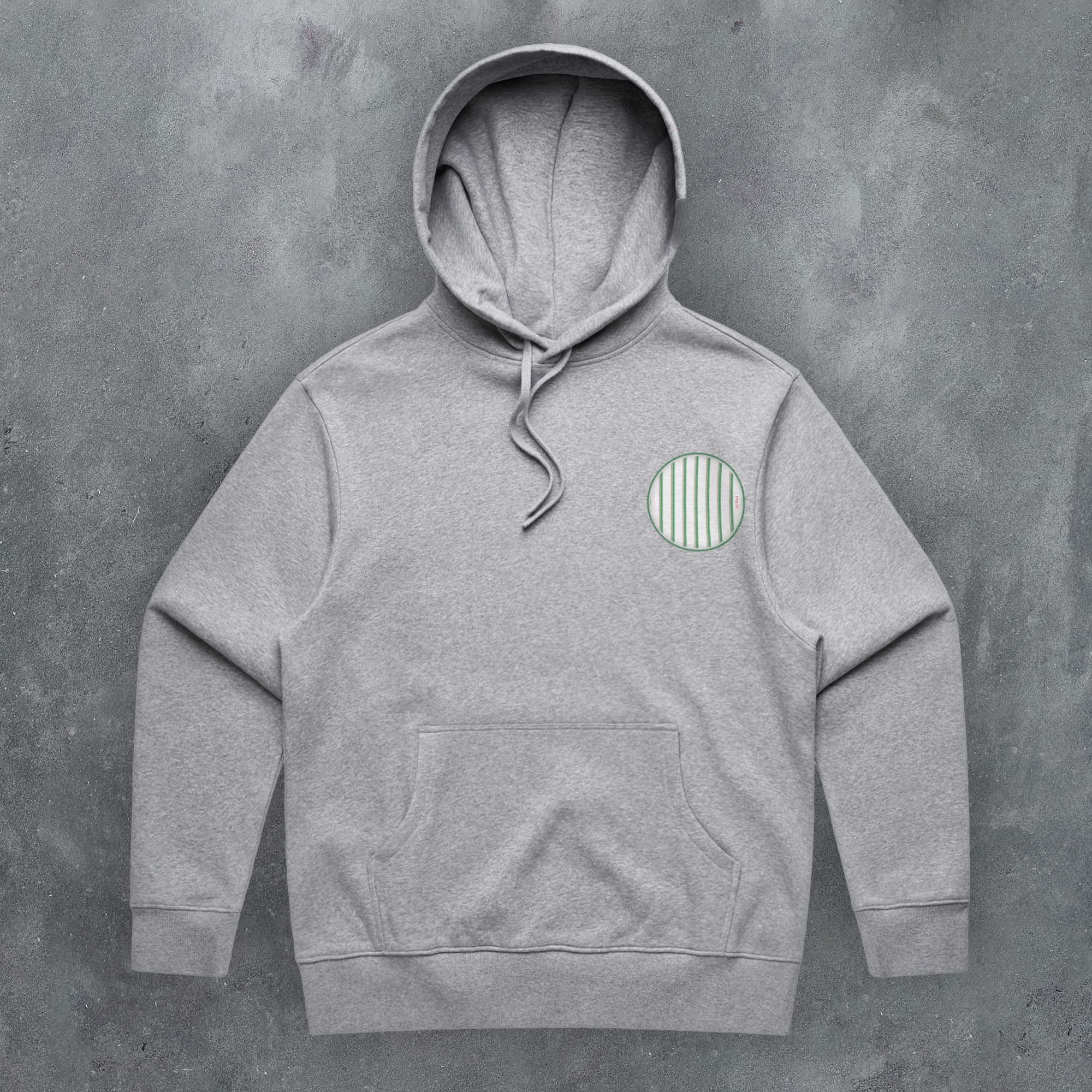 a grey hoodie with a green circle on it