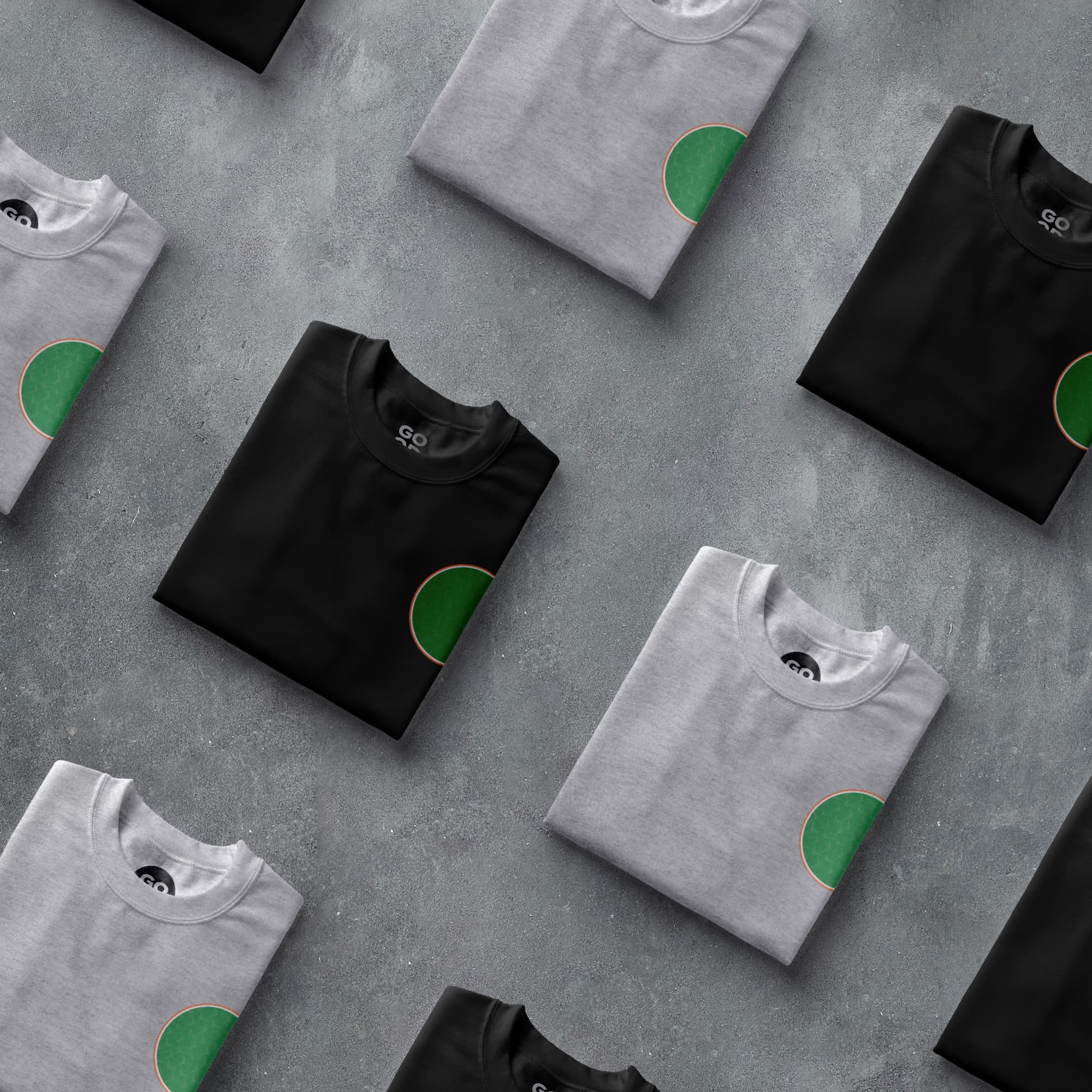 a group of t - shirts with green circles on them