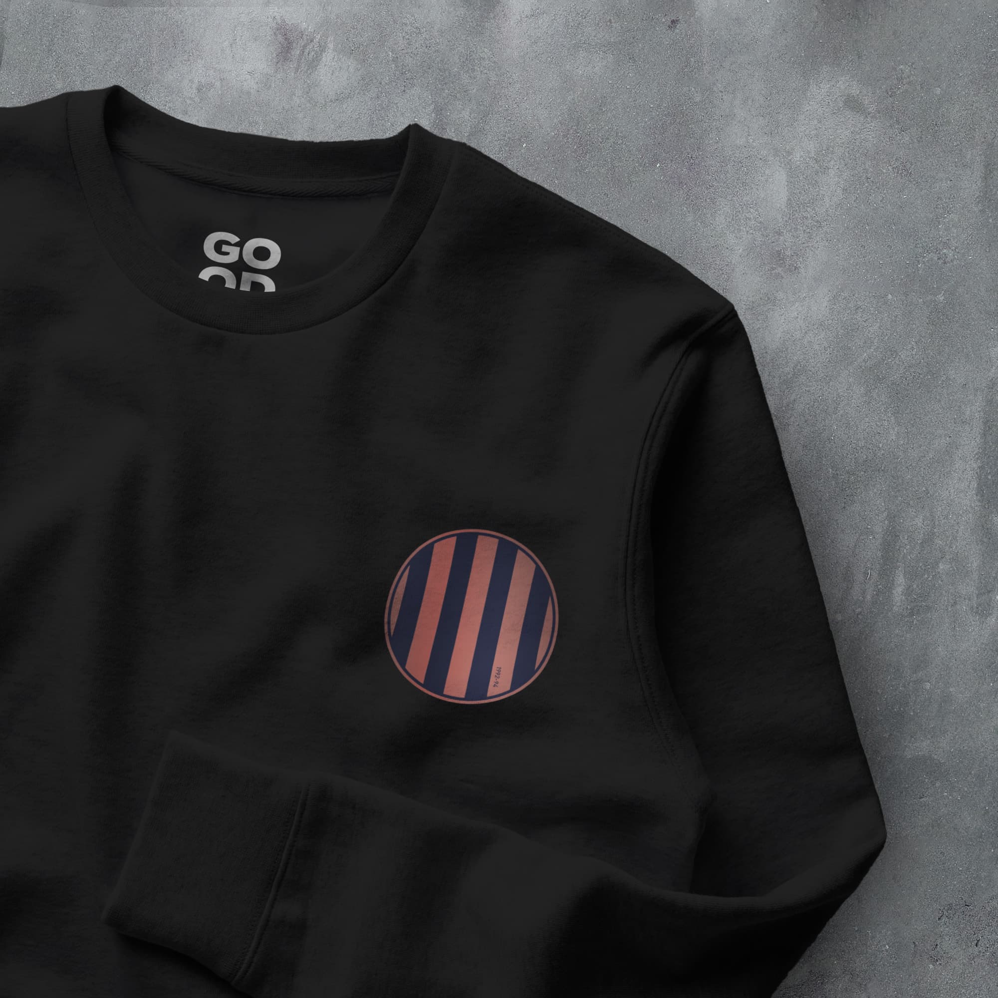a black sweatshirt with a red and blue striped pocket